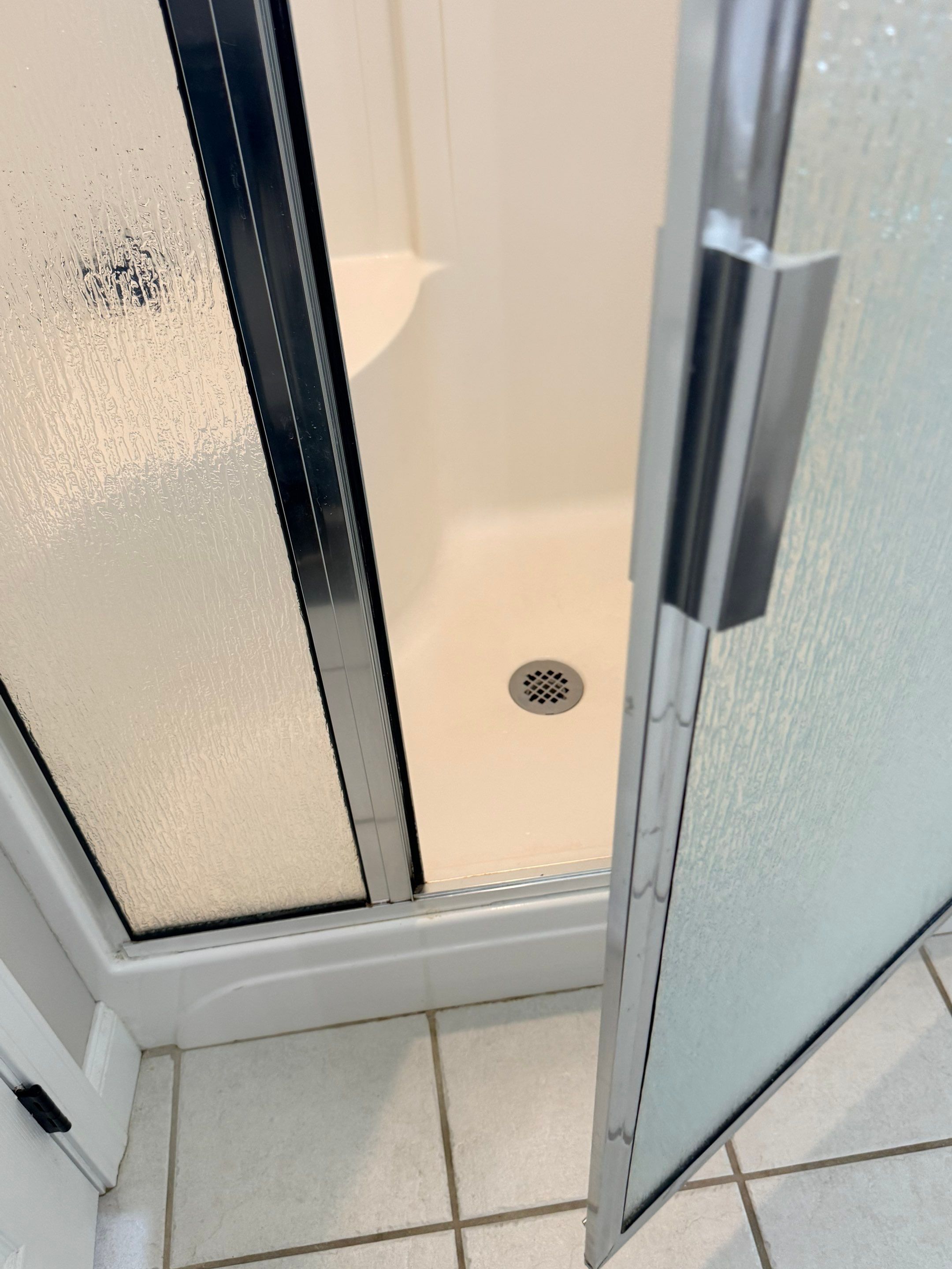Master Bathroom Renovation Featuring Dark Textured Shower Panels in Branson West by Kitchen Works LLC