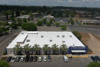 Metal roof restoration on commercial roof using Conklin Benchmark/ PUMA XL acrylic coatings over metal and foam