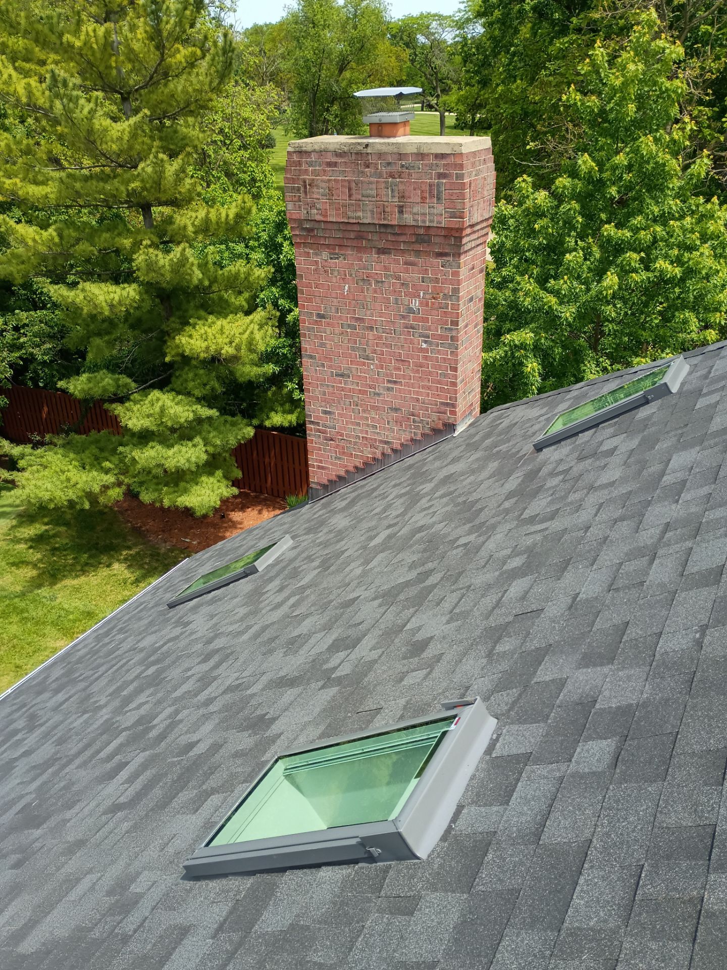 Asphalt Shingle Roof Replacement and Skylight Installation in Darien by Pro Home Services Inc