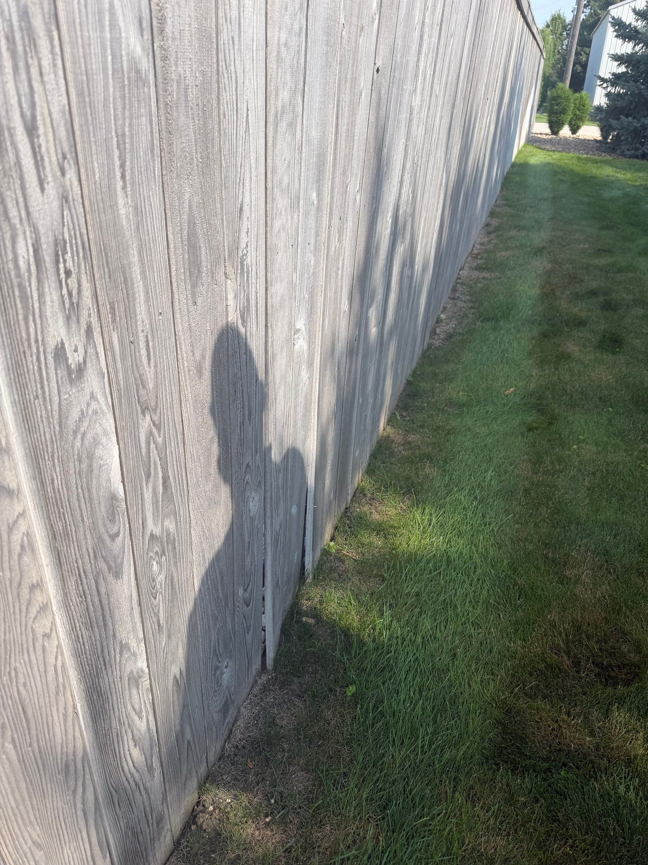 Custom Privacy Fence and Paver Patio Installation in Sioux Falls by Select Painting, Coatings & Garage Cabinets