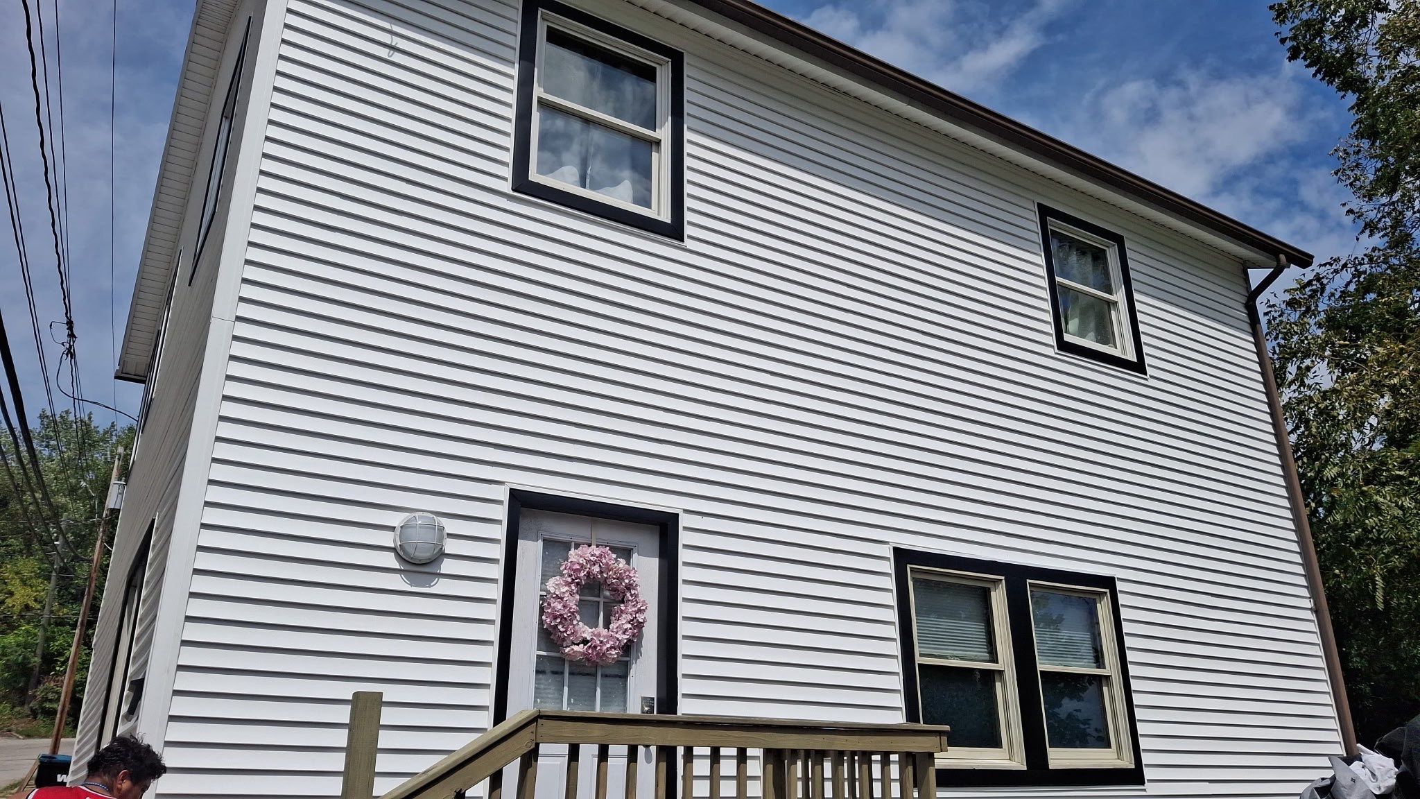 White siding  by Cousins Roofing Siding & Decks