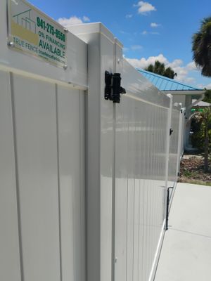 White Vinyl Privacy Fence Installation and Gate Repair in Port Charlotte