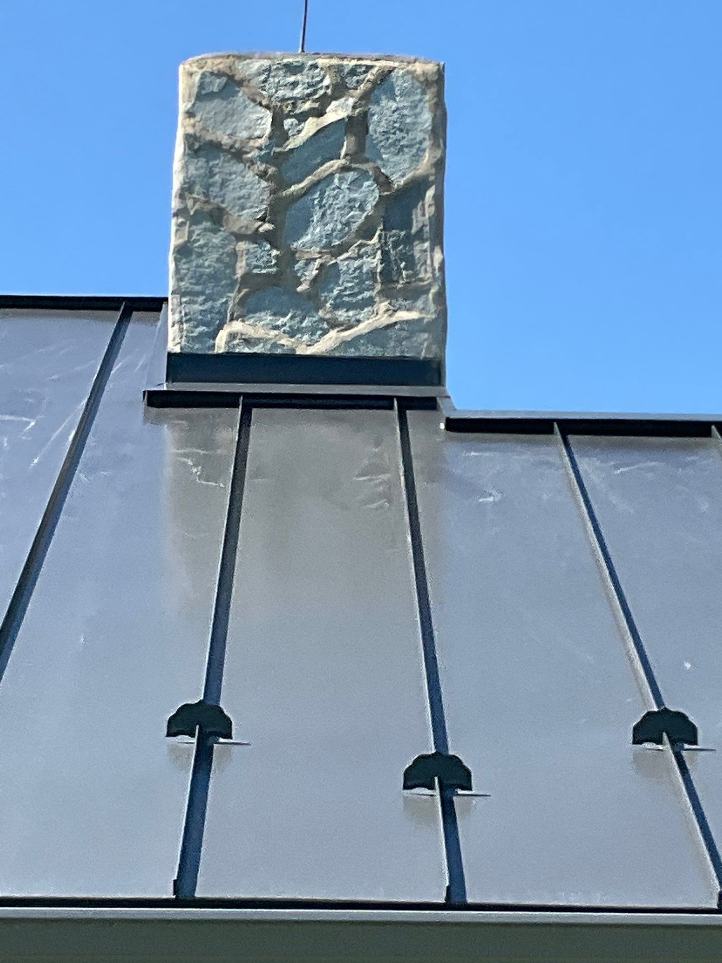 Metal roof-black by Esh Builders