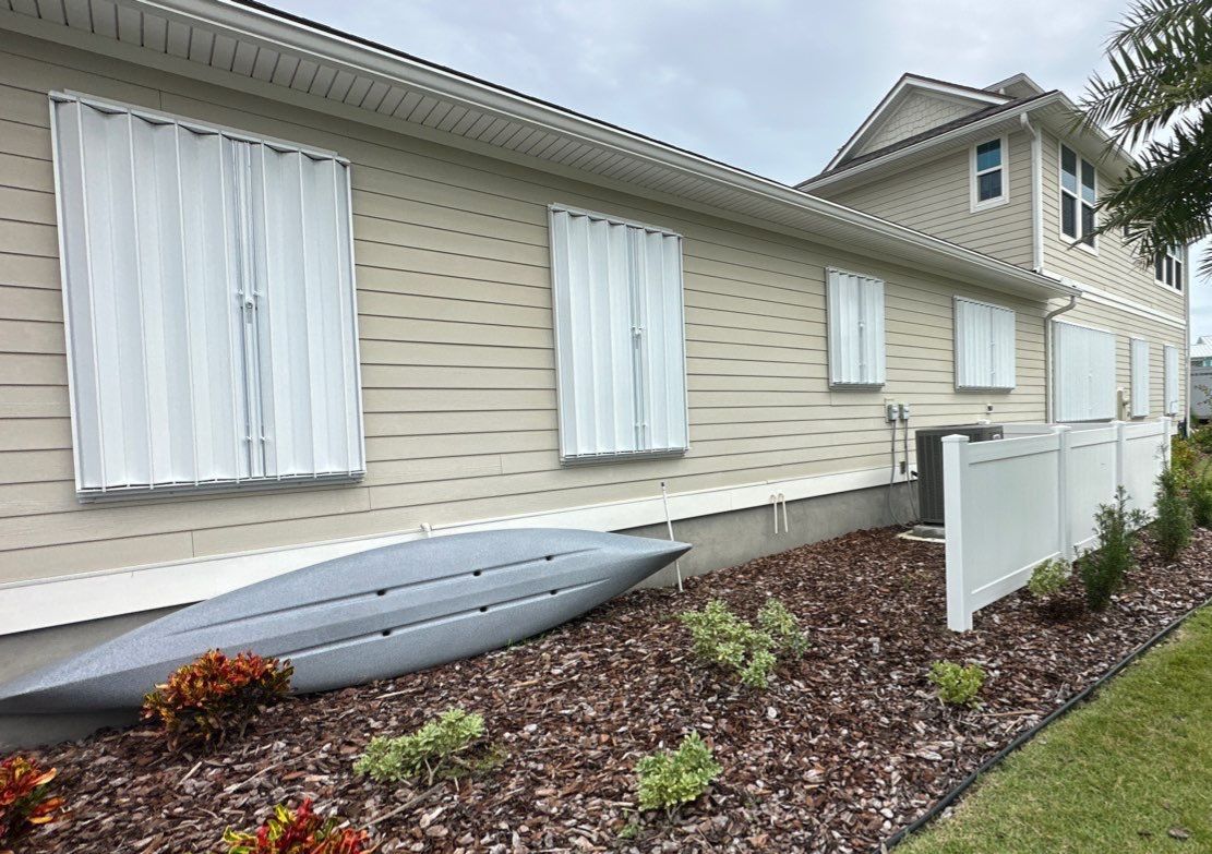 Hurricane Shutters using Accordions in White by Smart Guard Shutters