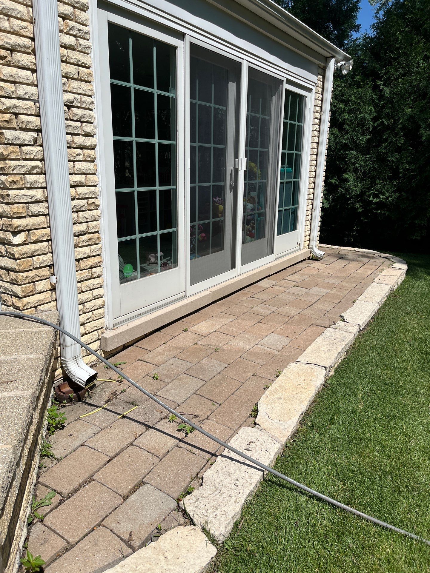 concrete power washing using Algaecide, soft wash soap by Northern Power Washing LLC.