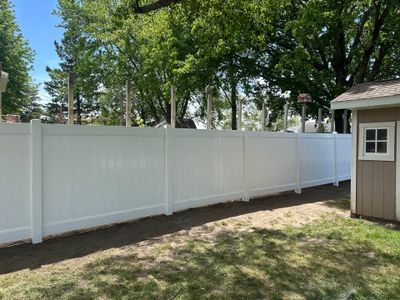 White Vinyl Privacy Fence Installation in Lawler, IA