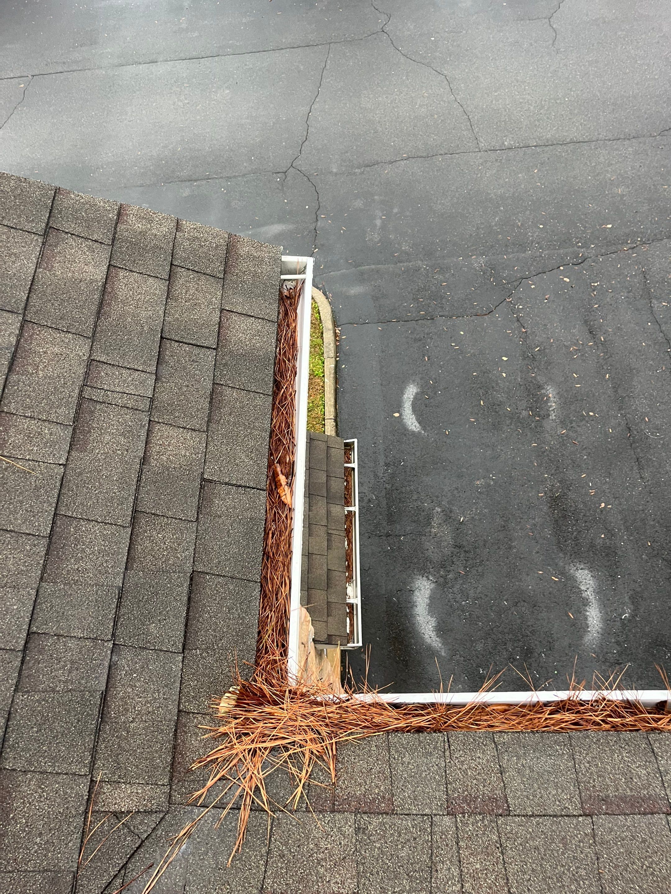 Commercial gutter cleaning Birmingham, AL before photo with filled gutters