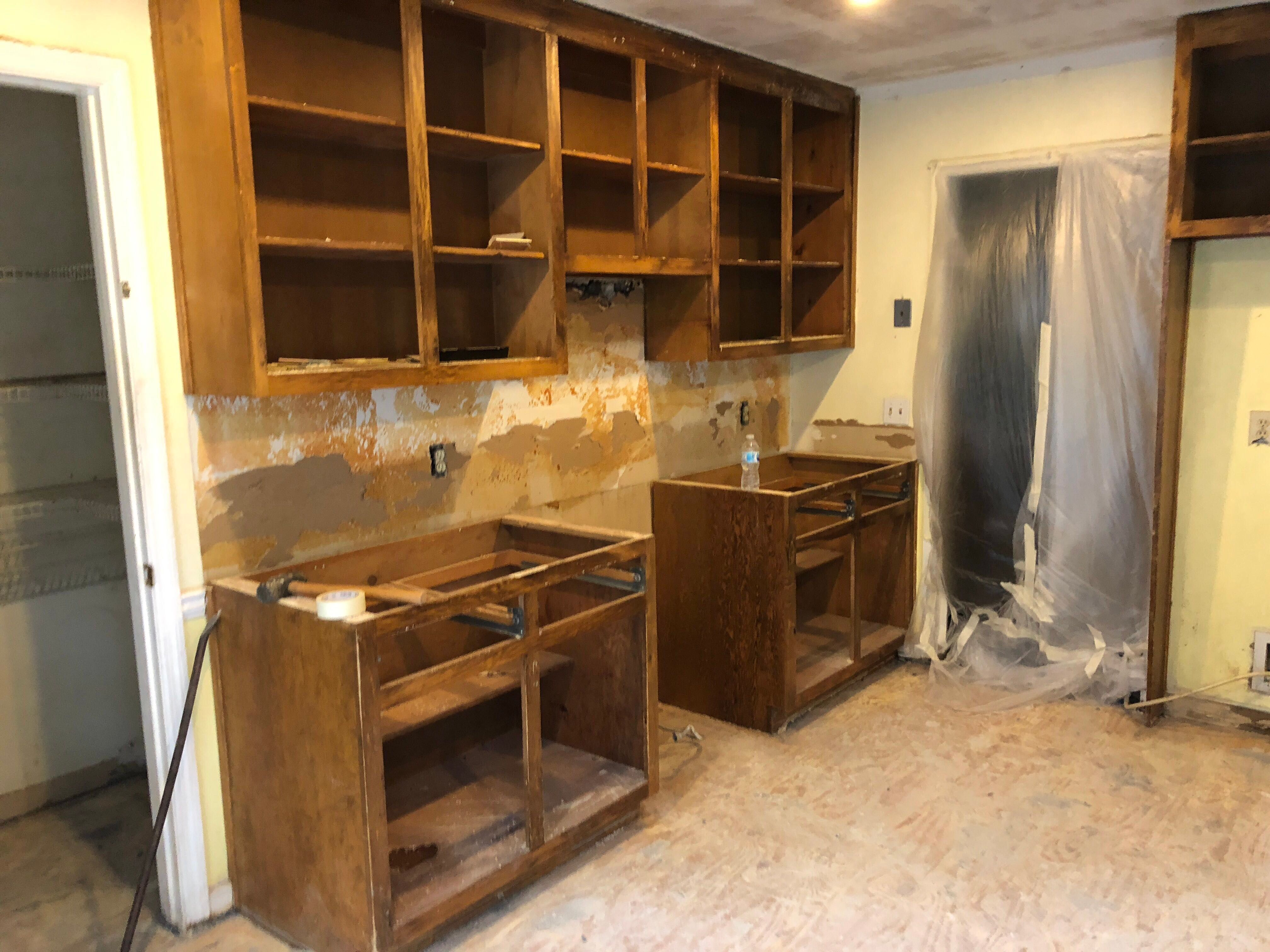 Open Concept Kitchen Remodel With White Shaker Cabinets in Kennesaw by Swift Home Renovations