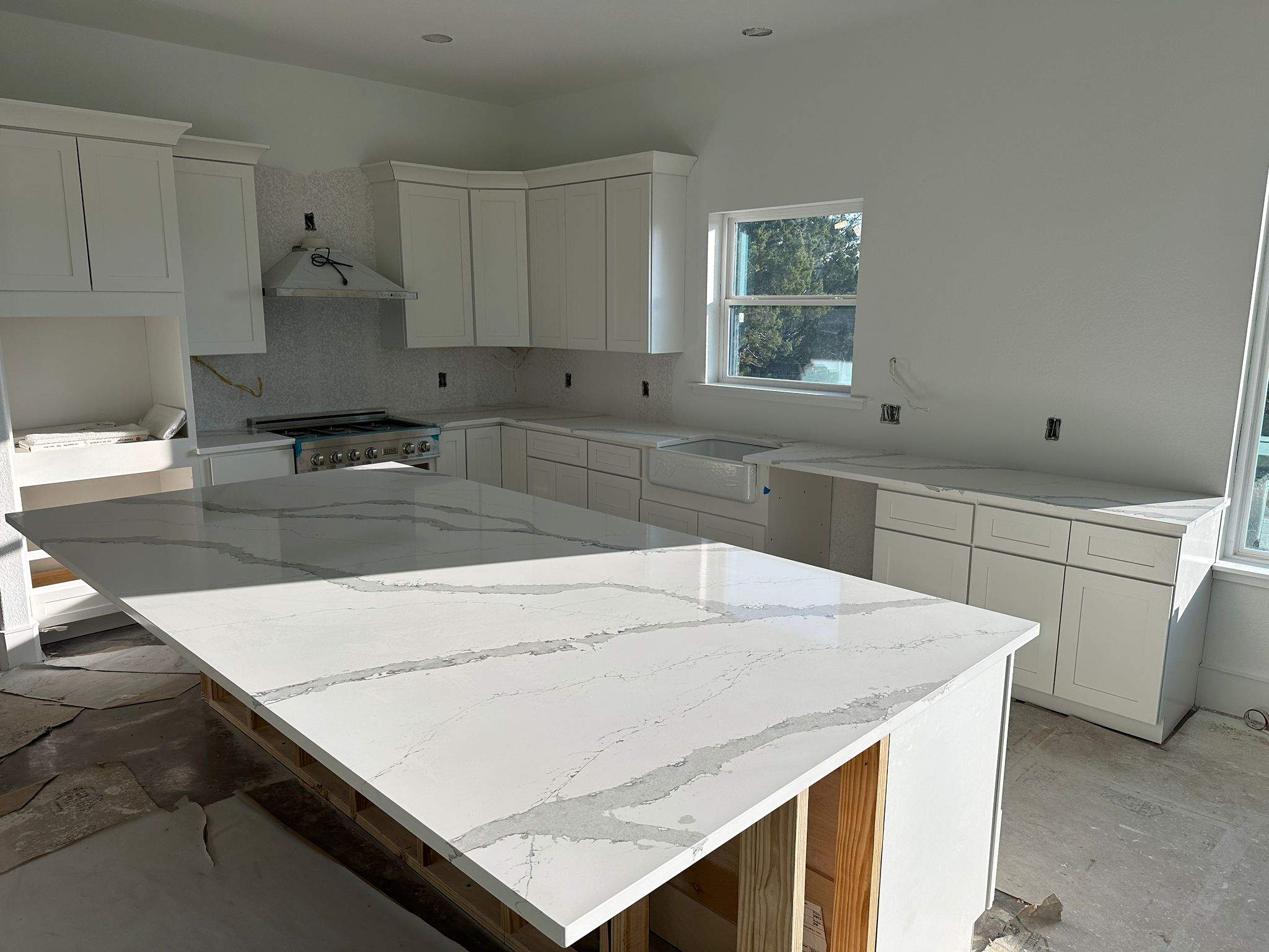 Kitchen and Bathroom Countertop Upgrades Featuring Gray Veined Quartz by Mena stone surfaces