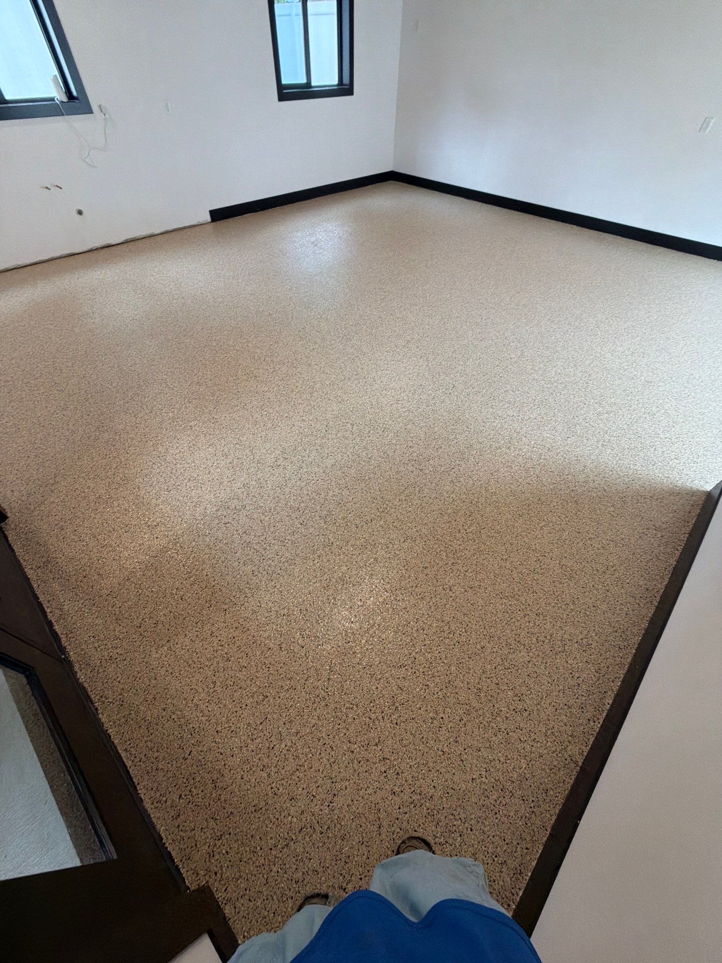 Multi-Room Epoxy Flake Floor Installation Throughout Pentwater Residence by Gordon Painting