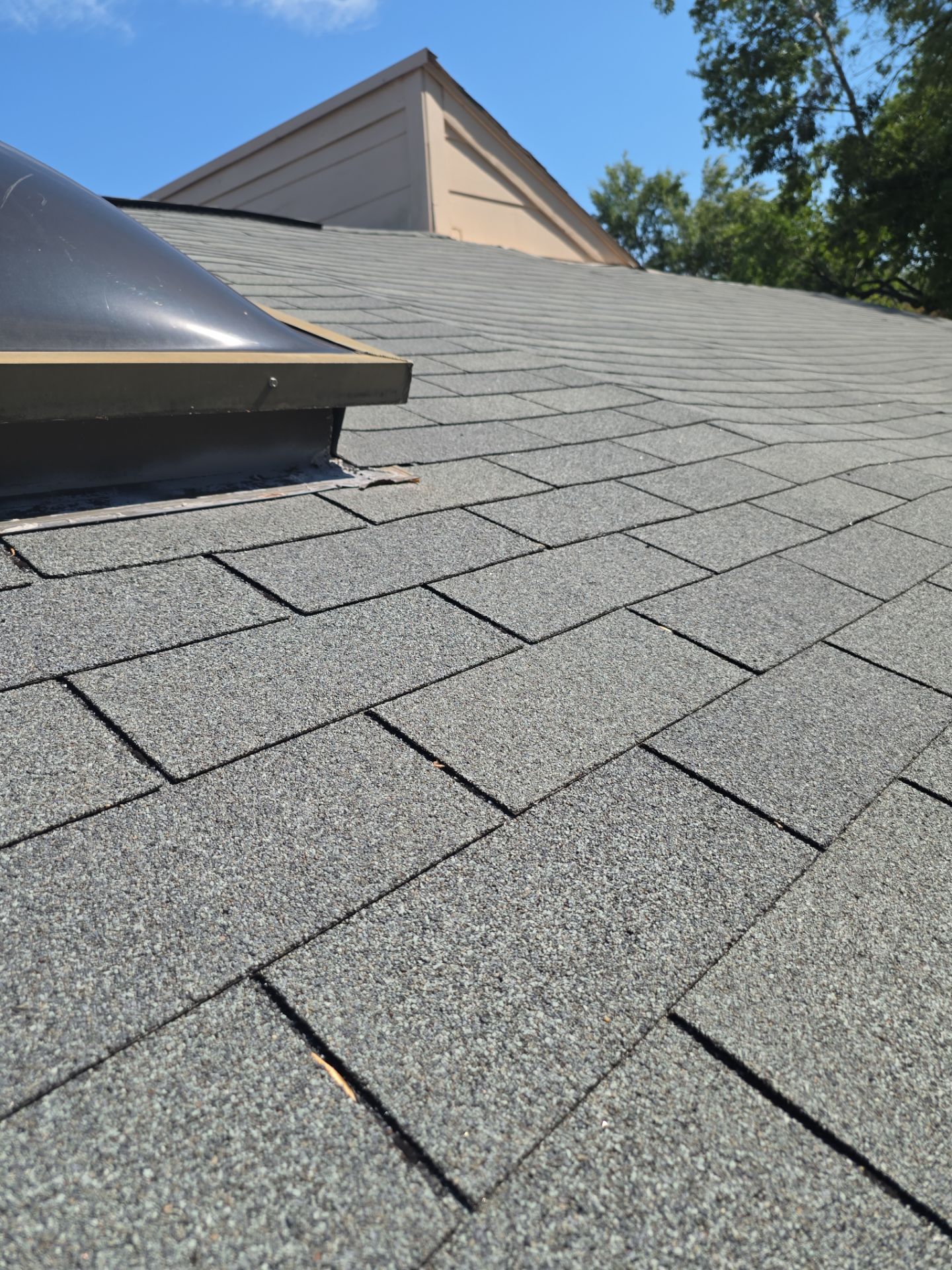 Asphalt Shingle Roof Repair and Skylight Sealing in Houston by One Legacy United