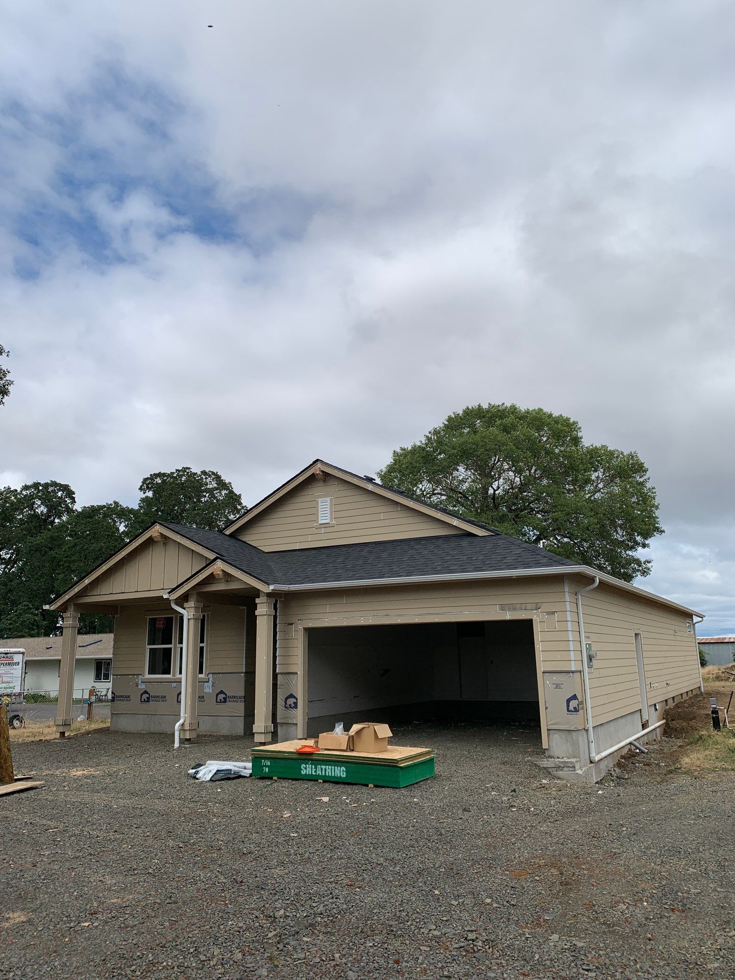 Seamless White Gutter Installation for Eugene New Construction Home