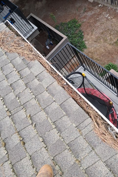 Commercial gutter cleaning Modesto, CA before photo with filled gutters