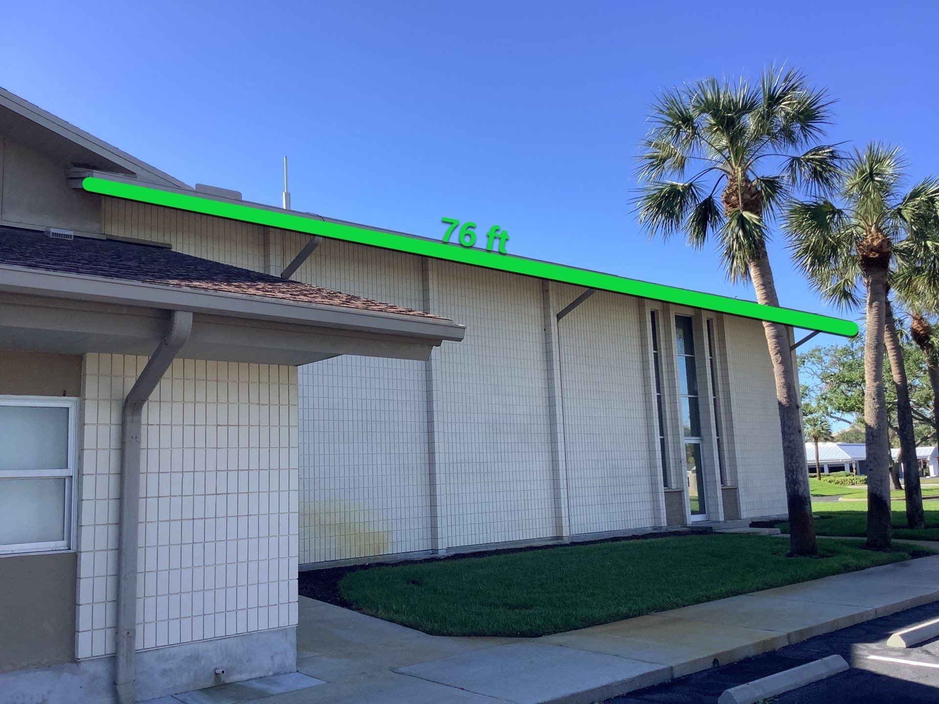Grey Aluminum Gutters with Downspouts in Sarasota FL by Gutter Professors
