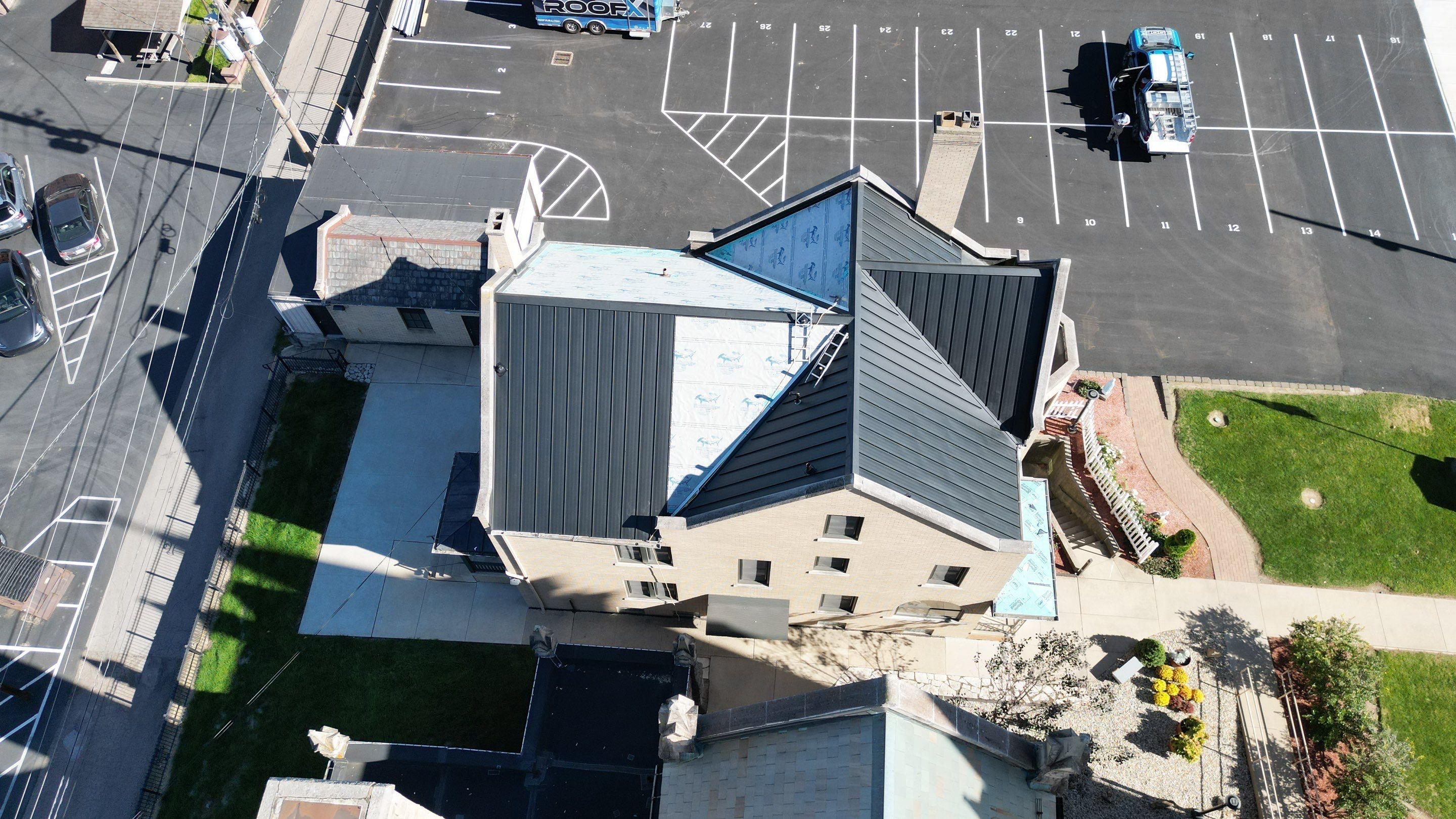 Commercial Roofing Installation using Standing Seam Metal - Frost Black by RoofX 