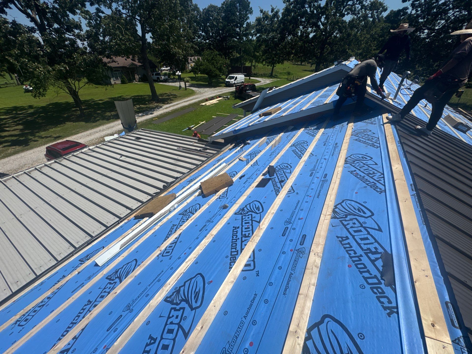 Residential Roof + Gutters & Downspouts & Gutter Covers Install  by Titan Commercial & Residential Roofing 