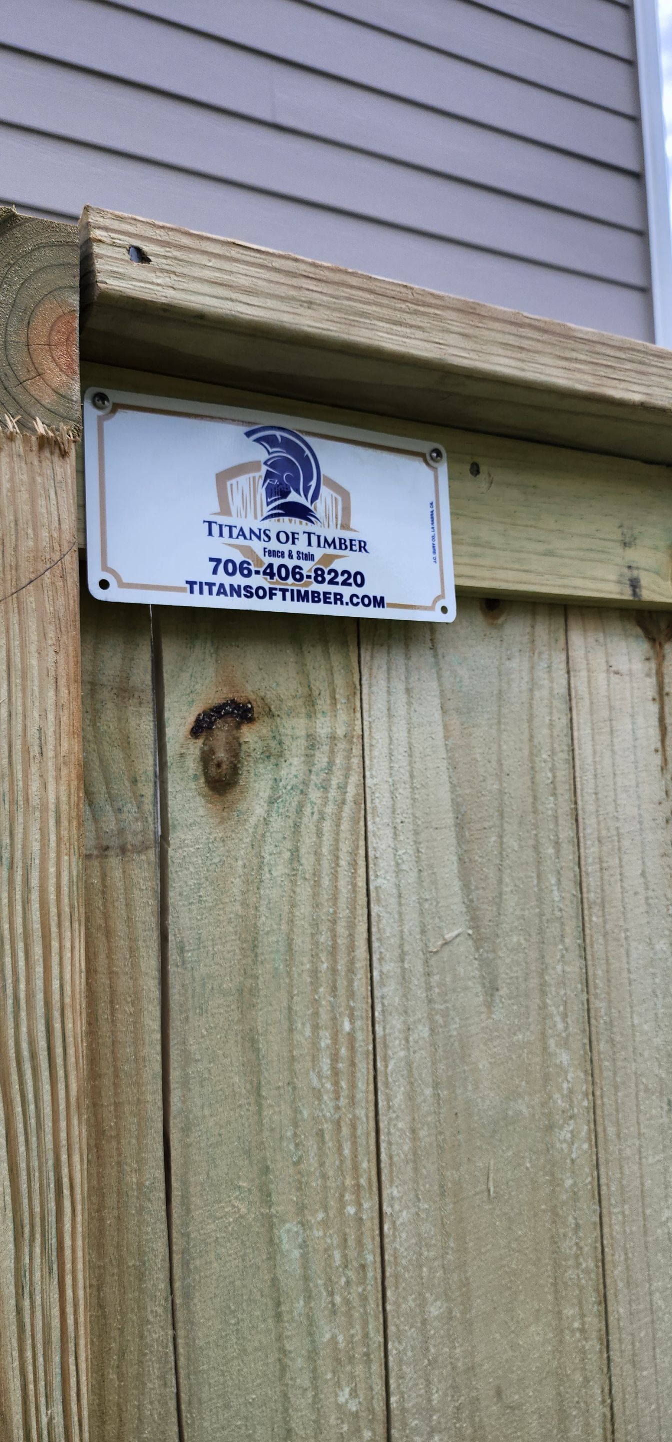 Fence Installation of Capped Wood Privacy by Titans of Timber Fence & Stain