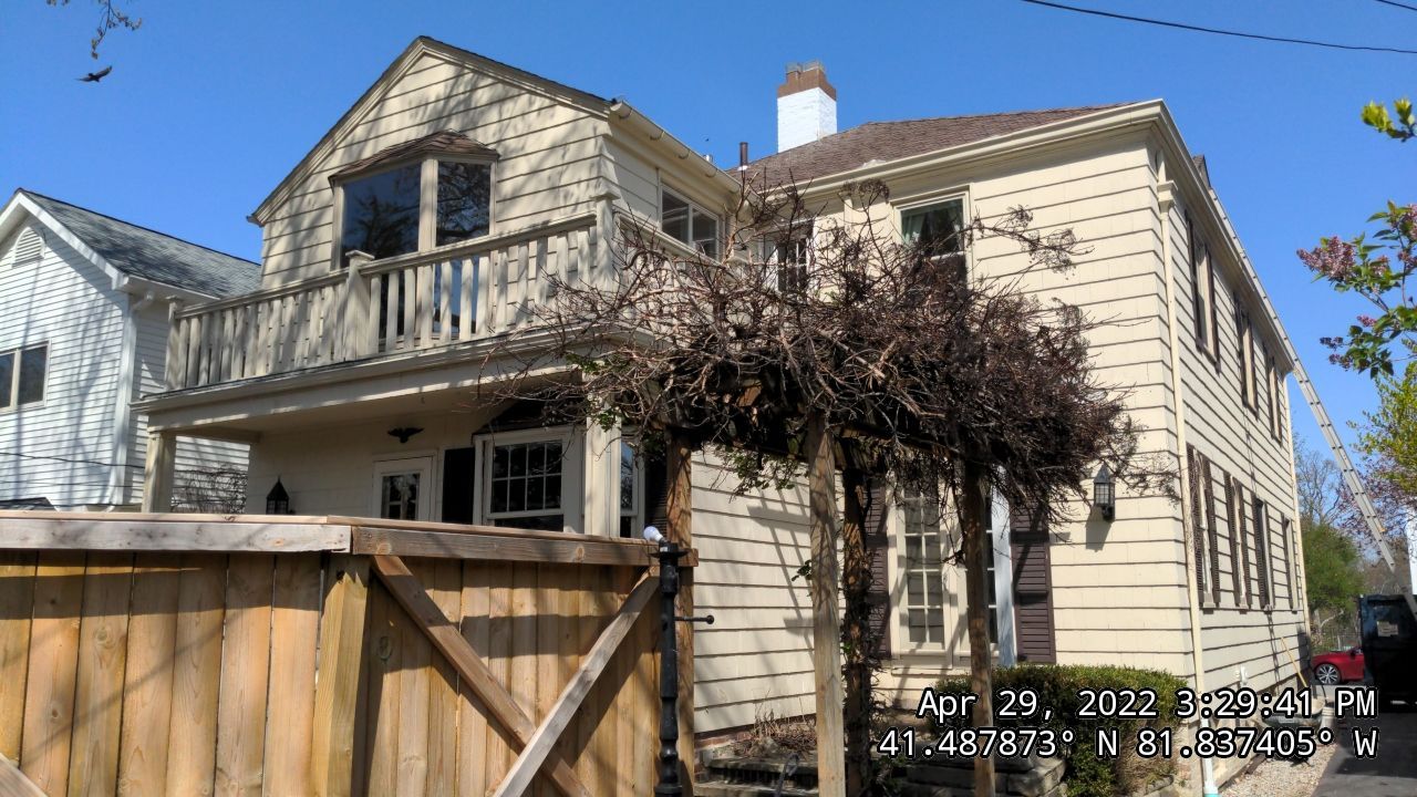 Residential Roofing Installation, Dec-tek walk-out porch roof, siding on garage by Absolute Roofing and Construction