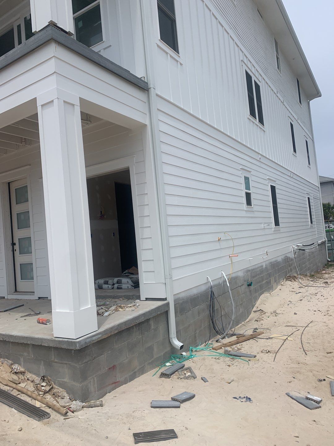 Downspout Installation for Multi-Story Building in Panama City FL by Gutter Professors