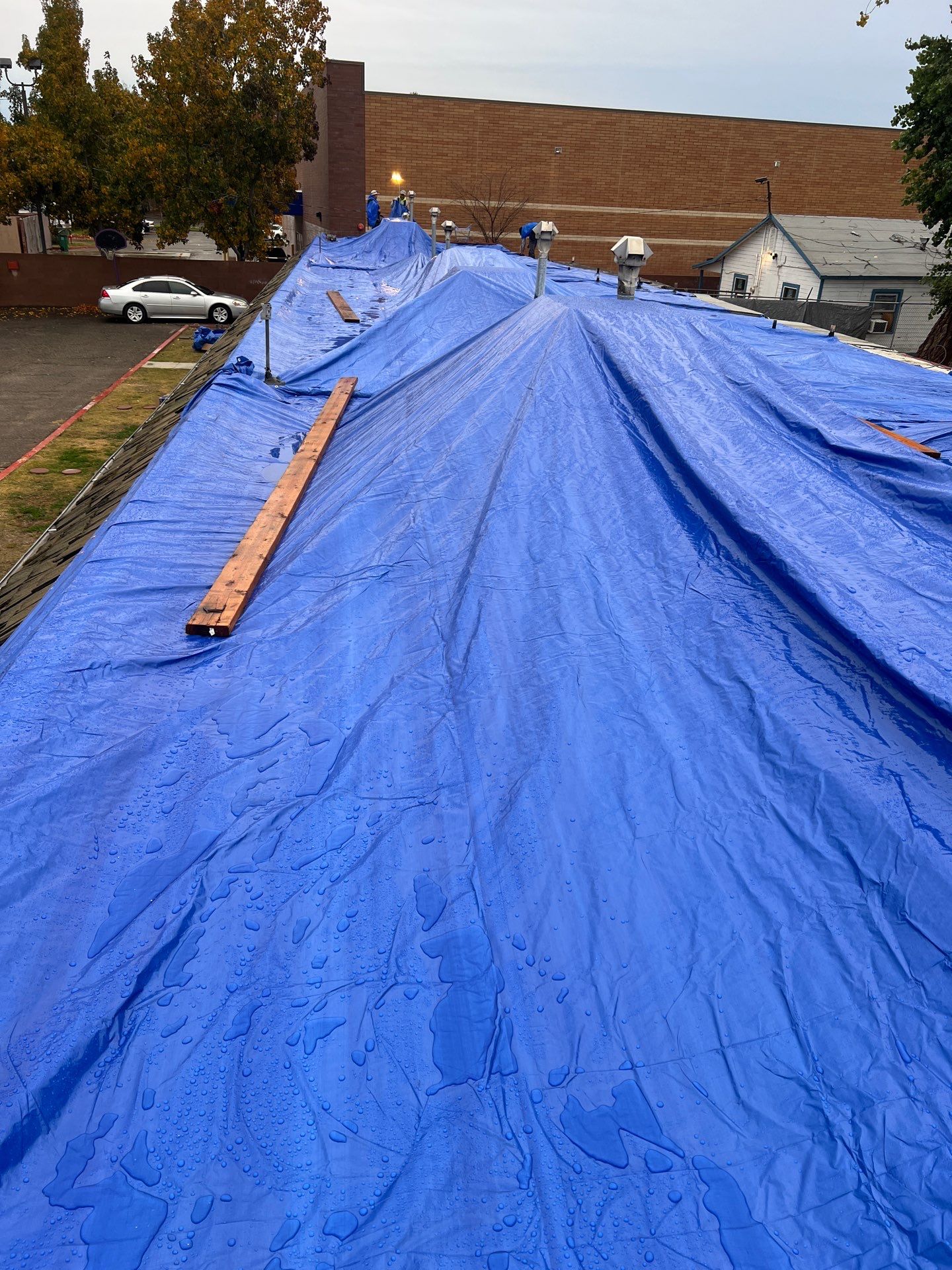 Emergency Roof Tarp Service - Fresno, CA by Grandmark Service Company