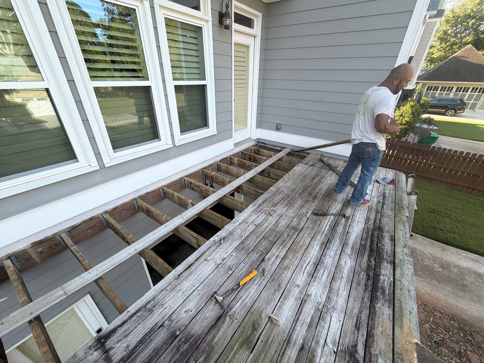 Elevated Composite Deck Replacement with Metal Railings in Smyrna by Swift Home Renovations 