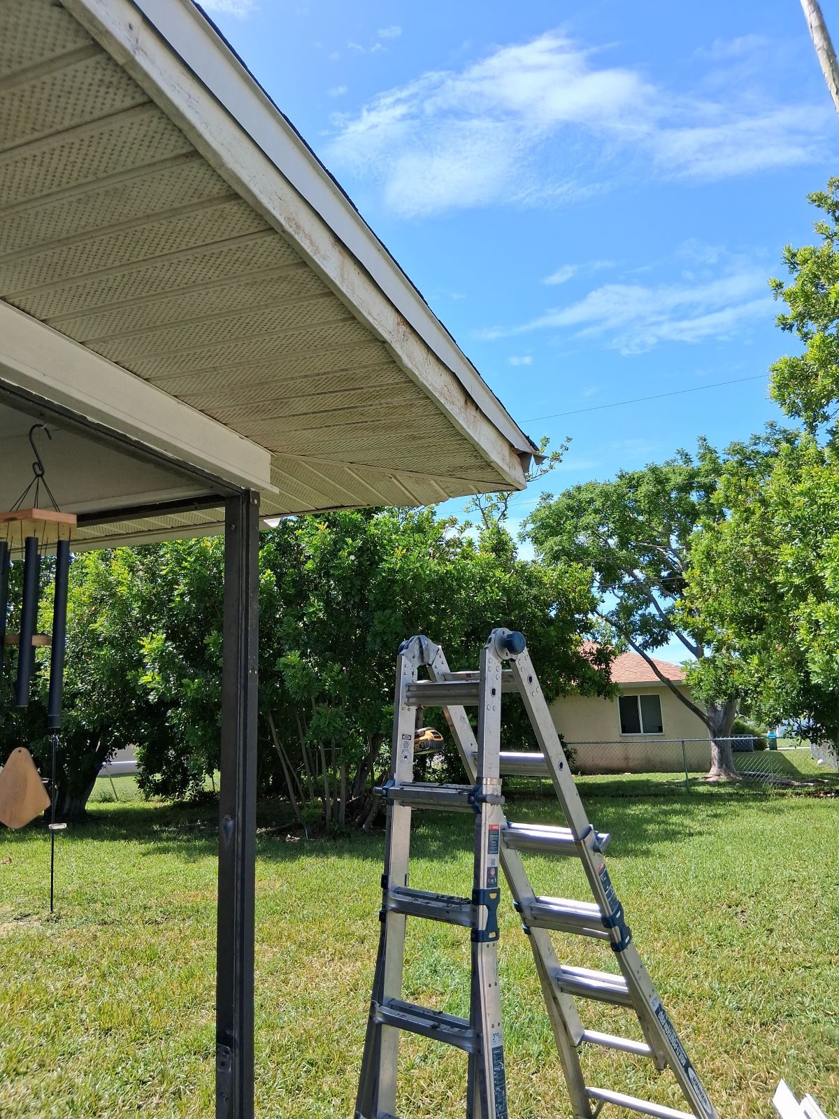 Replace gutter using White Down Spouts in Cape Coral FL by Gutter Professors