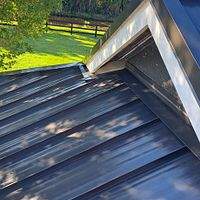 24ga 1.5" Mechanical Seam Matte Black by Total Roofing System The Metal Roof Experts