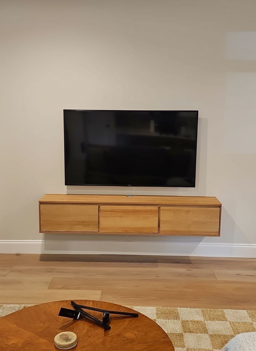 Floating Furniture, Fireplace Mantel, & Electric Fireplace Installation Projects by Hangman Mounting & Installation 