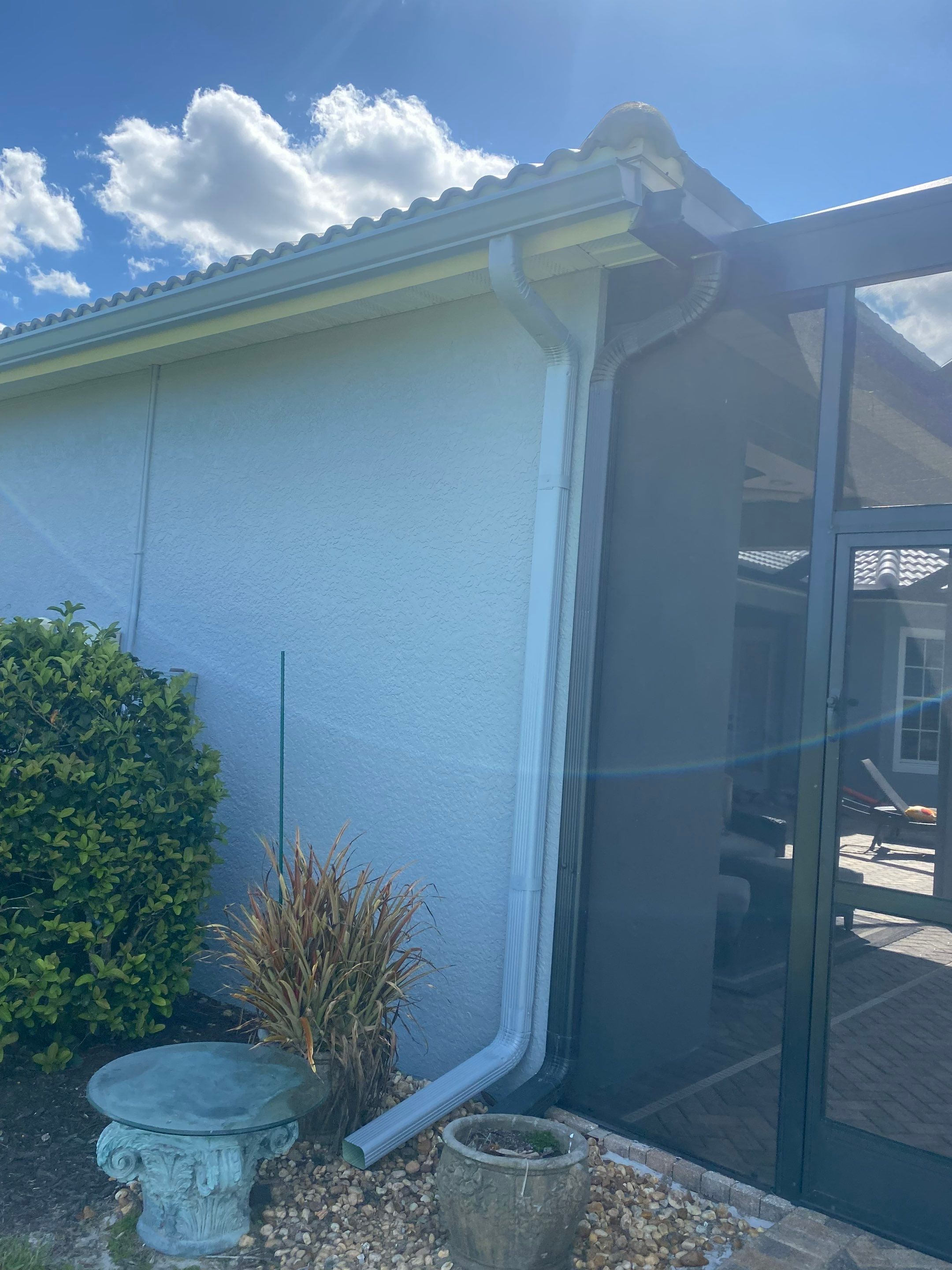 6-inch K-style Seamless Gutters and Splash Guard in Grey Color in Naples FL by Gutter Professors