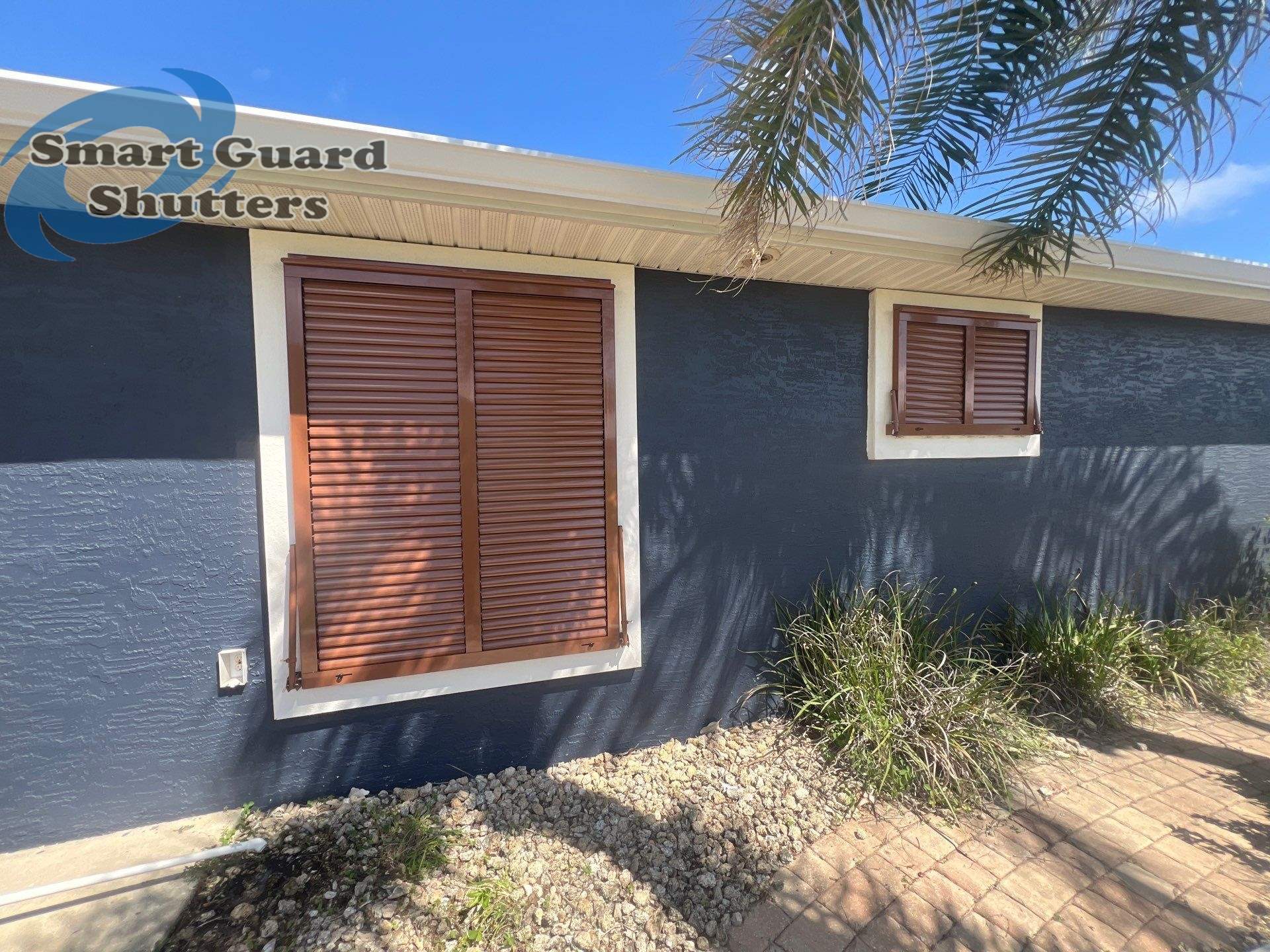 Impact Rated Bahama Shutters in Beige Brown by Smart Guard Shutters