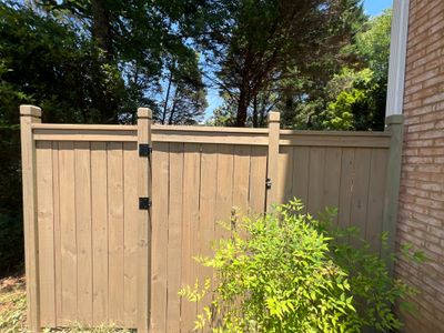 Pressure-Treated Wood Fence Installation and Deck Staining in Atlanta