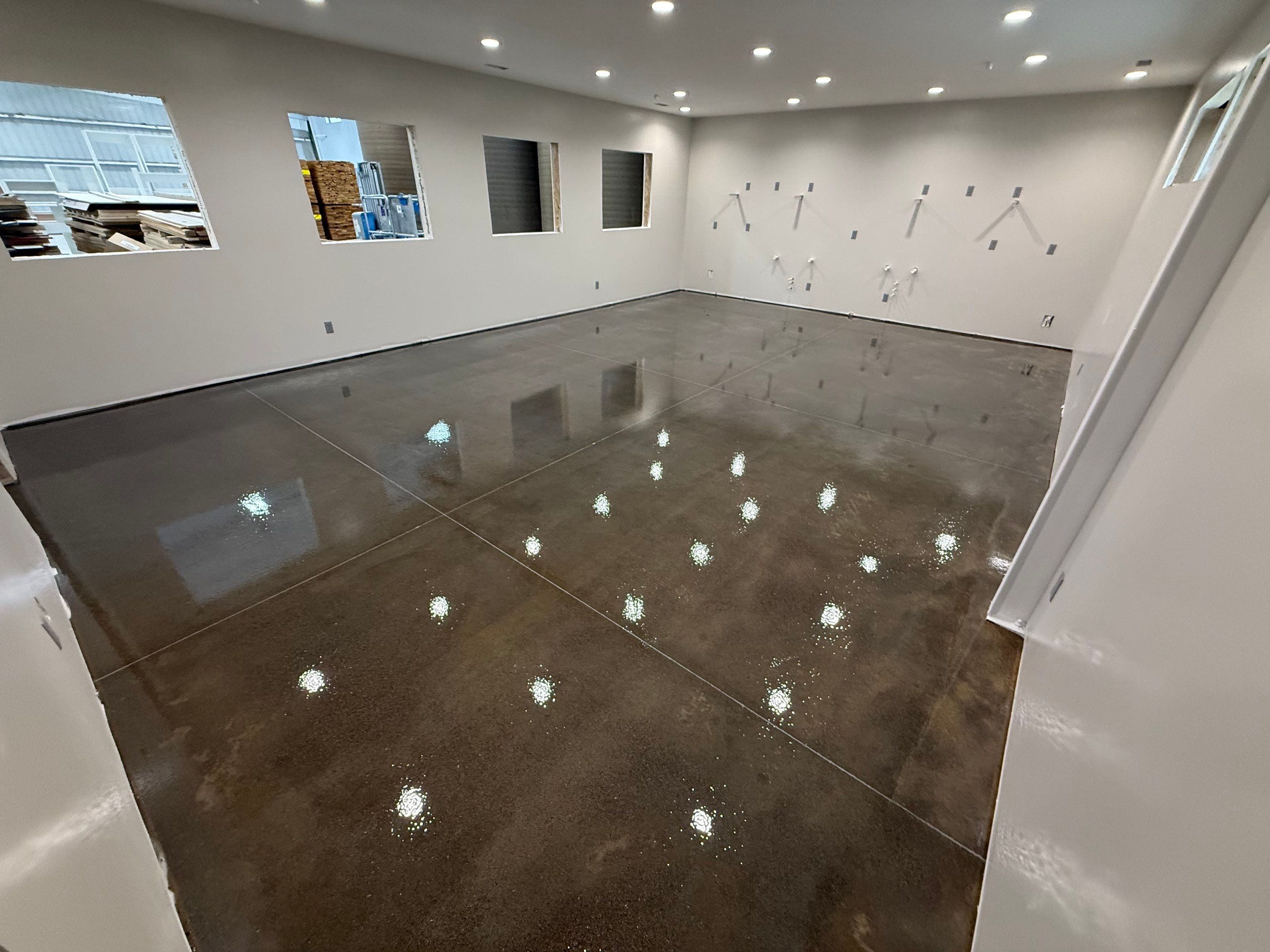 Industrial Concrete Polishing and Coating for Large Manufacturing Warehouse by Select Painting, Coatings & Garage Cabinets