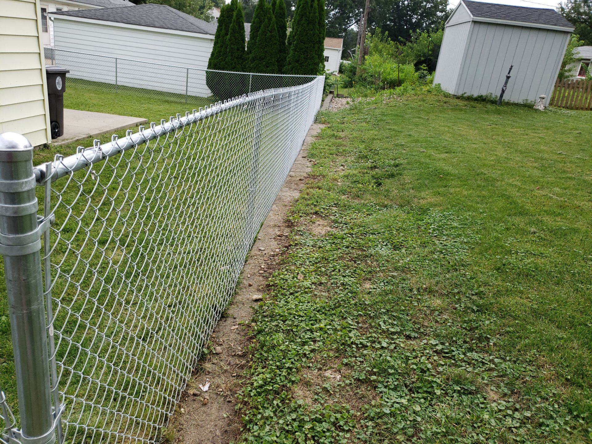 Residential Chain Link Fence and Gate Installation in Waterloo by Perfect Picket Fence and Stain