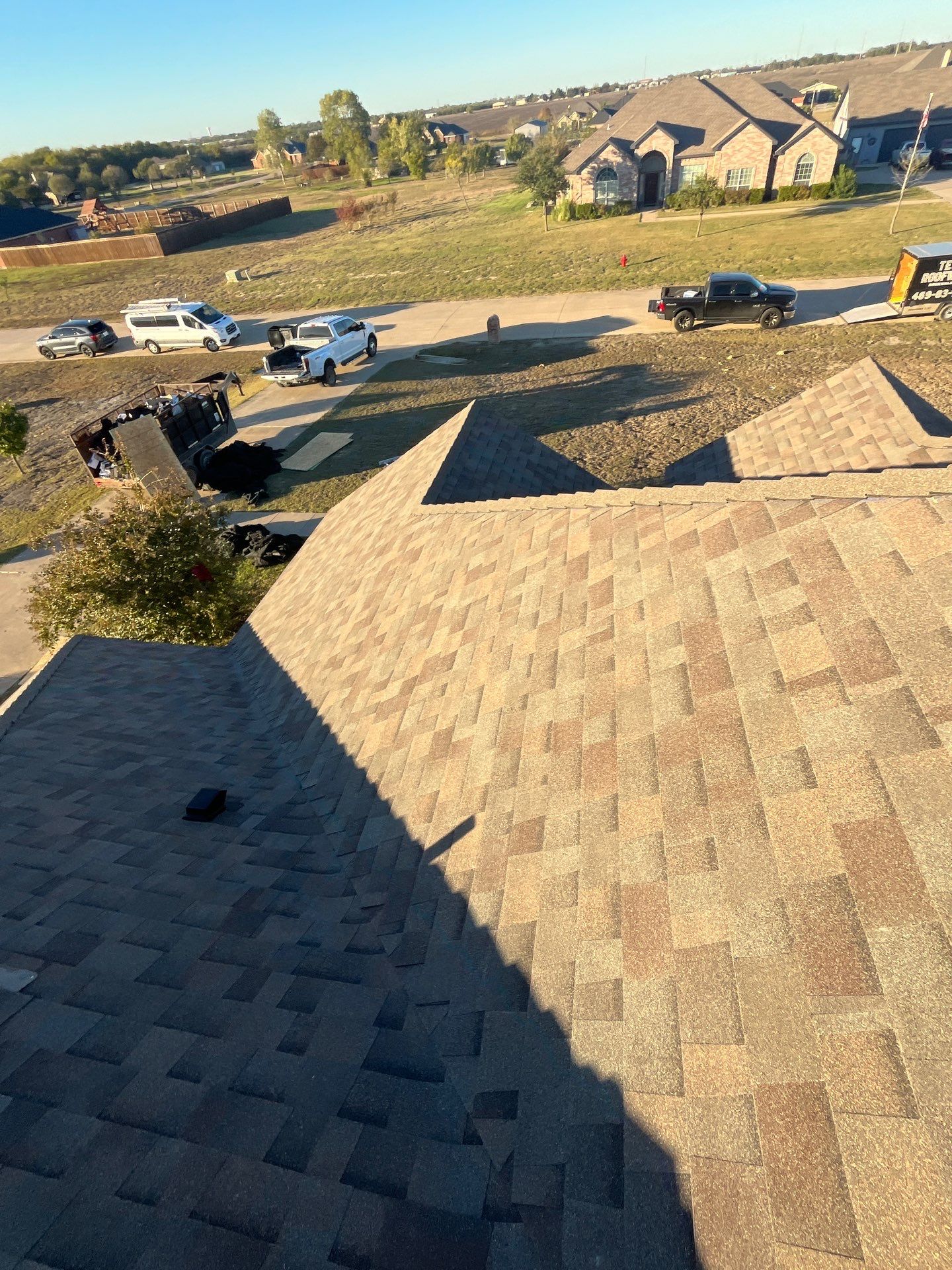 Brick with Malarkey Natural Wood by Tejas Roofworks + Restoration