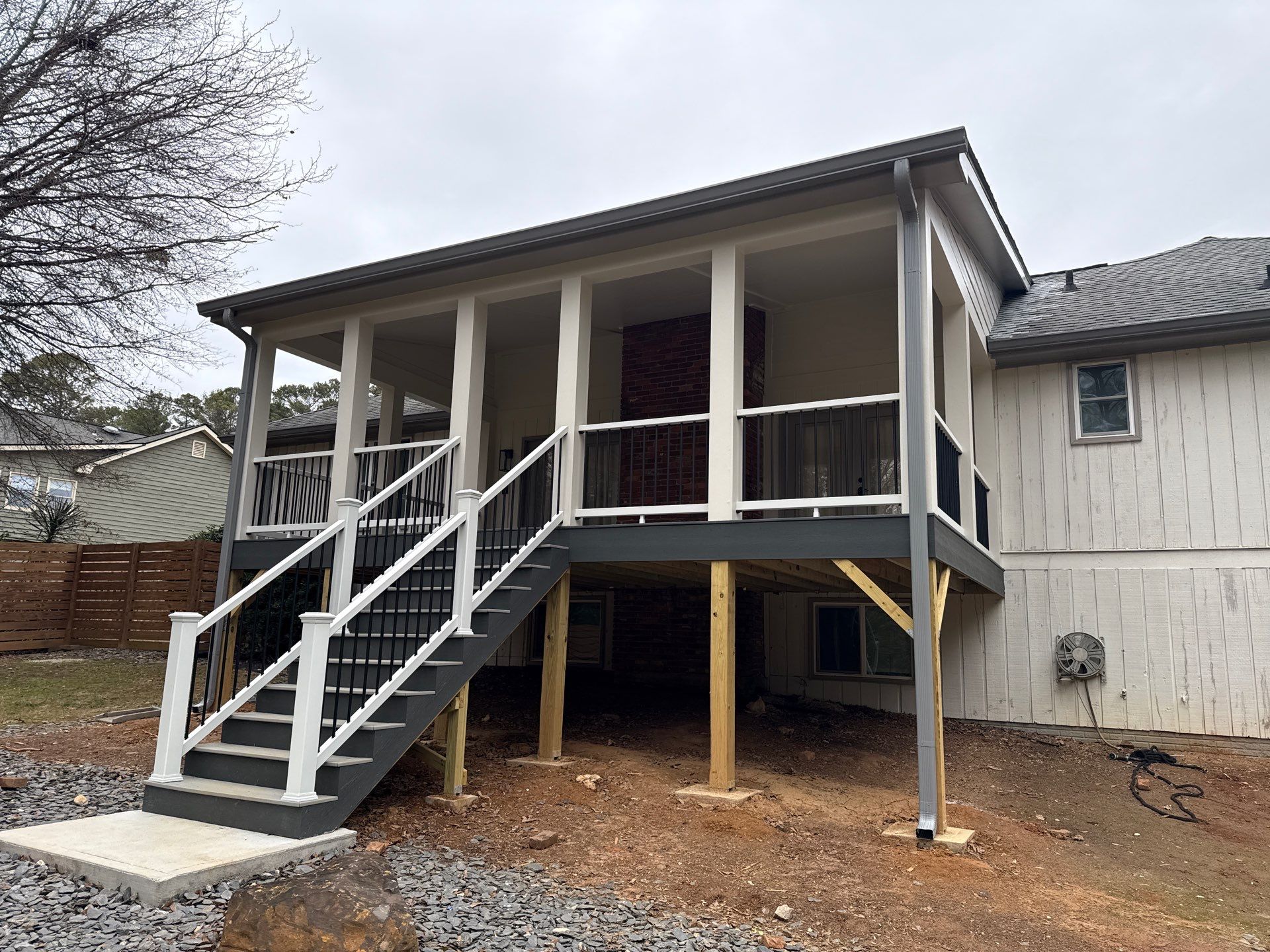 Deck and Shed Roof Style Covered Build using Trex Decking Products by Nelson Exteriors 