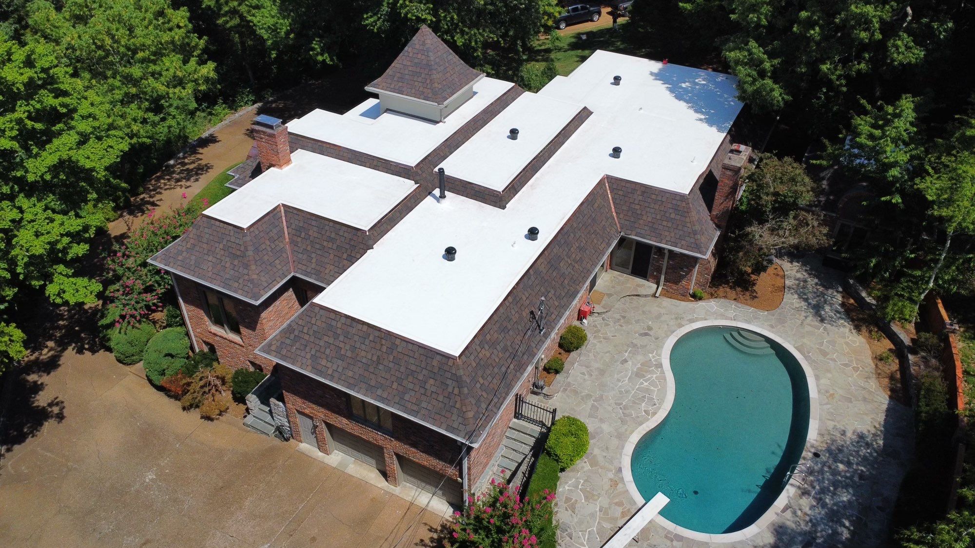 Residential Roofing Installation using Certainteed Belmont Shingles and TPO by Undersun Roofing 