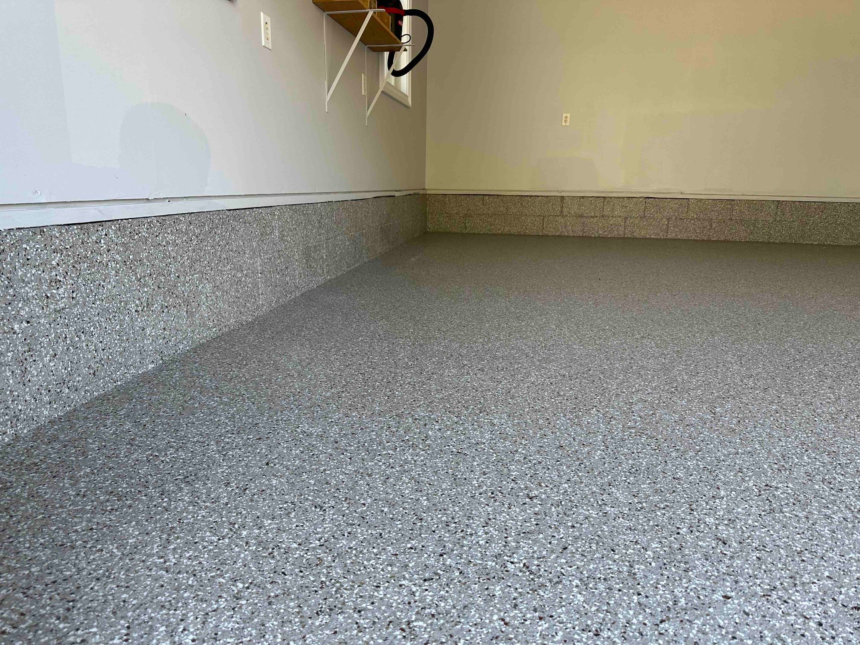 Front Porch and Garage using Creekbed by Elite Floor Solutions