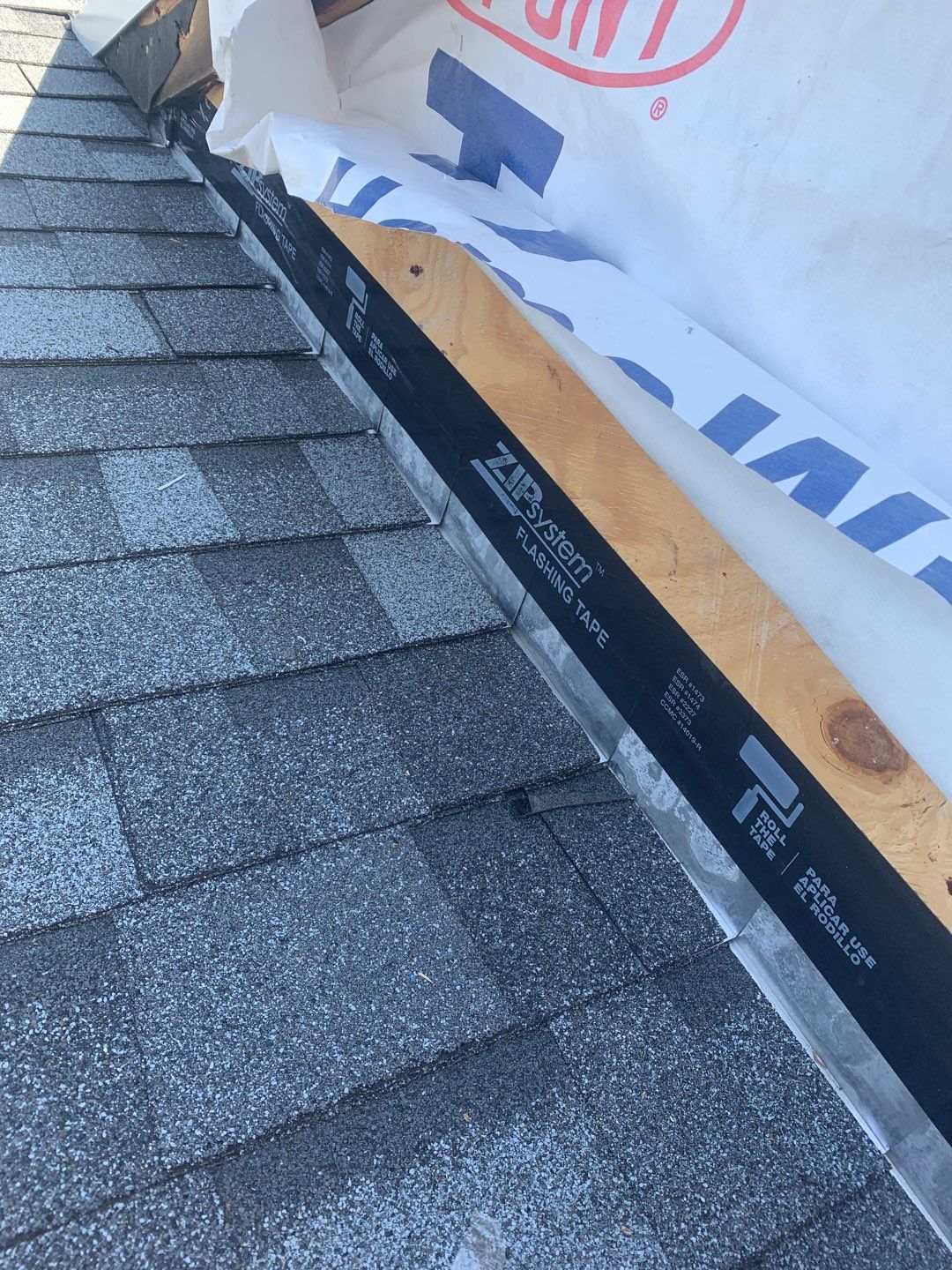 Commercial Roofing Installation using EPDM with white gutters by A Plus Exterior