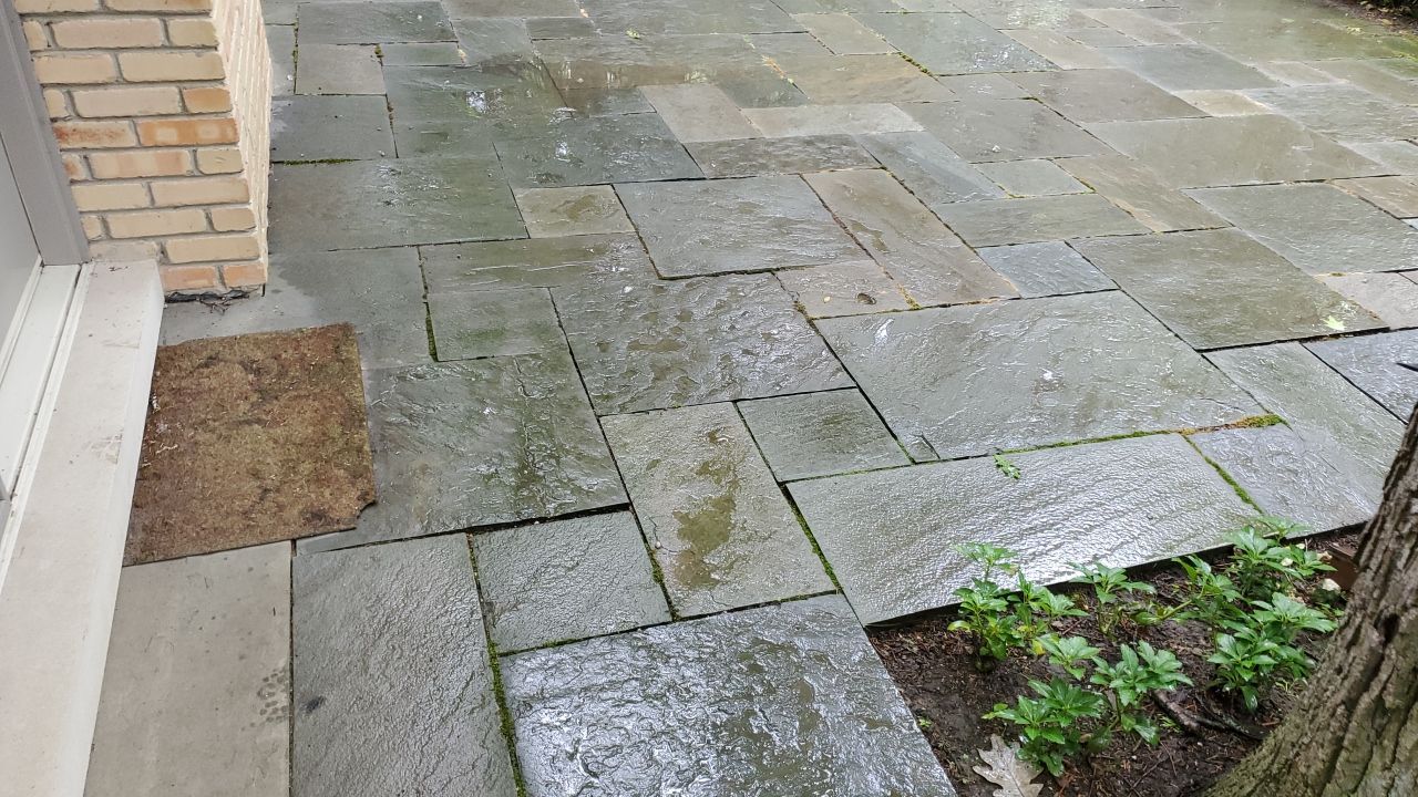 Bluestone patio cleaning by Northern Power Washing LLC.