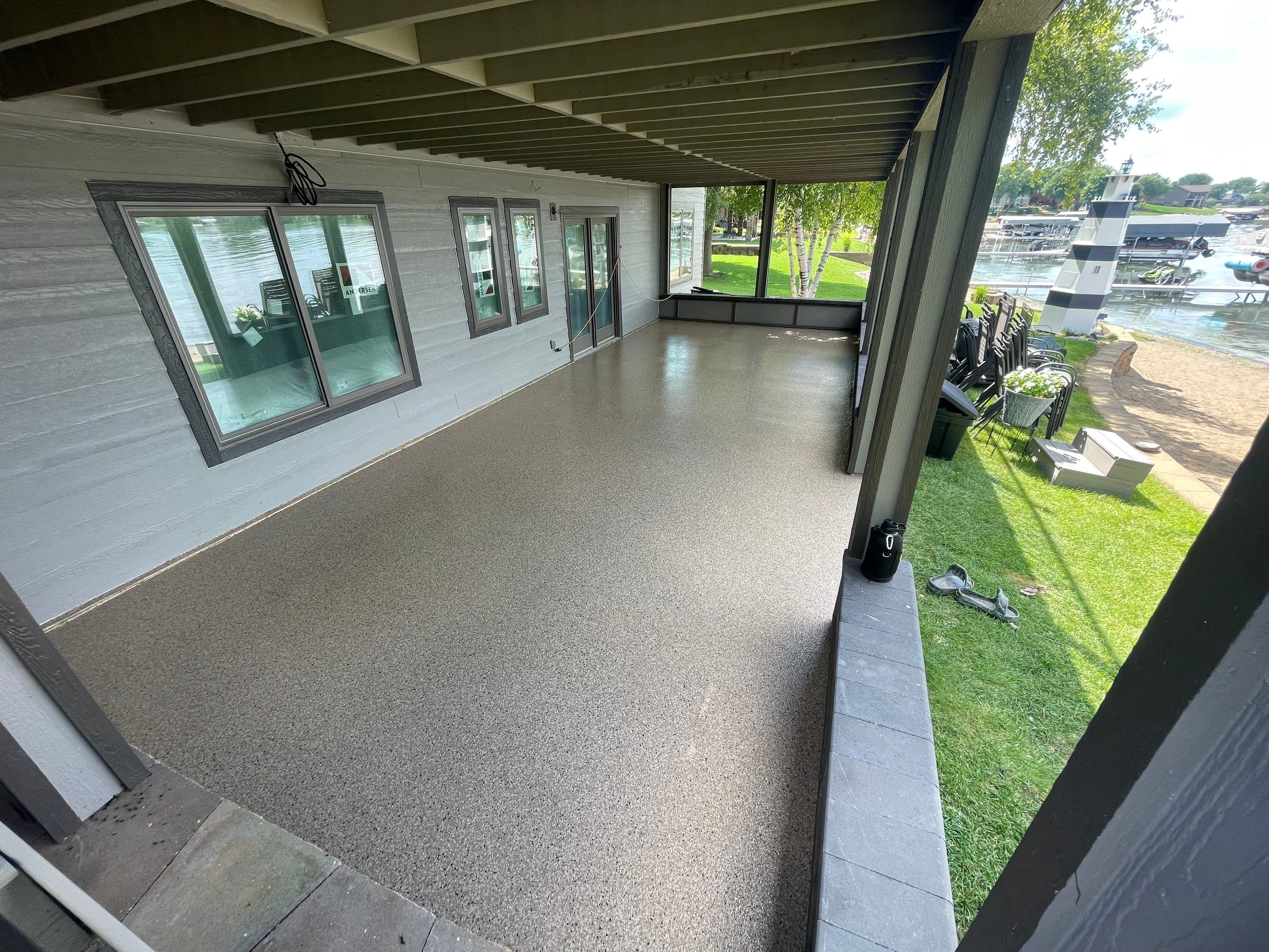 Lakefront Screened Patio Concrete Coating Installation in Wentworth by Select Painting, Coatings & Garage Cabinets