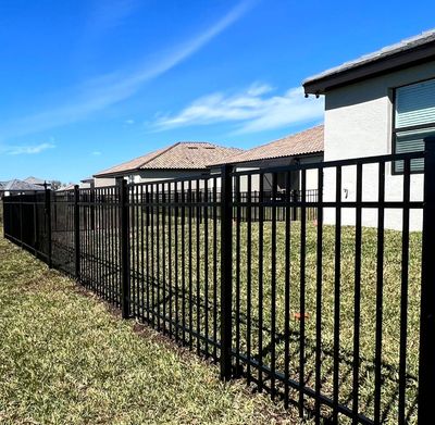 Aluminum Fence Installation using Black 3 Rail Aluminum Fence