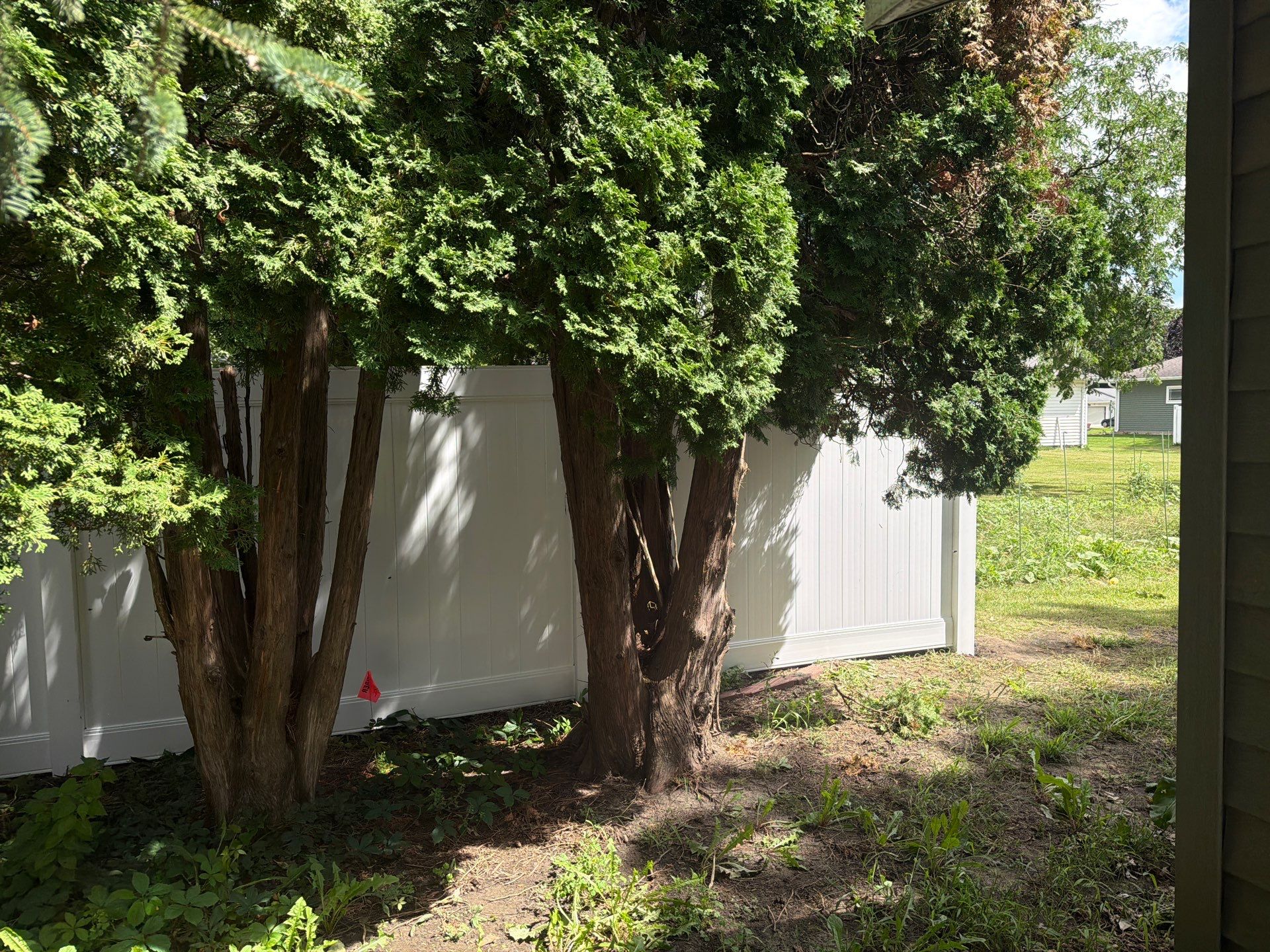 Residential White Vinyl Privacy and Black Chain Link Fencing in Jesup by Perfect Picket Fence and Stain