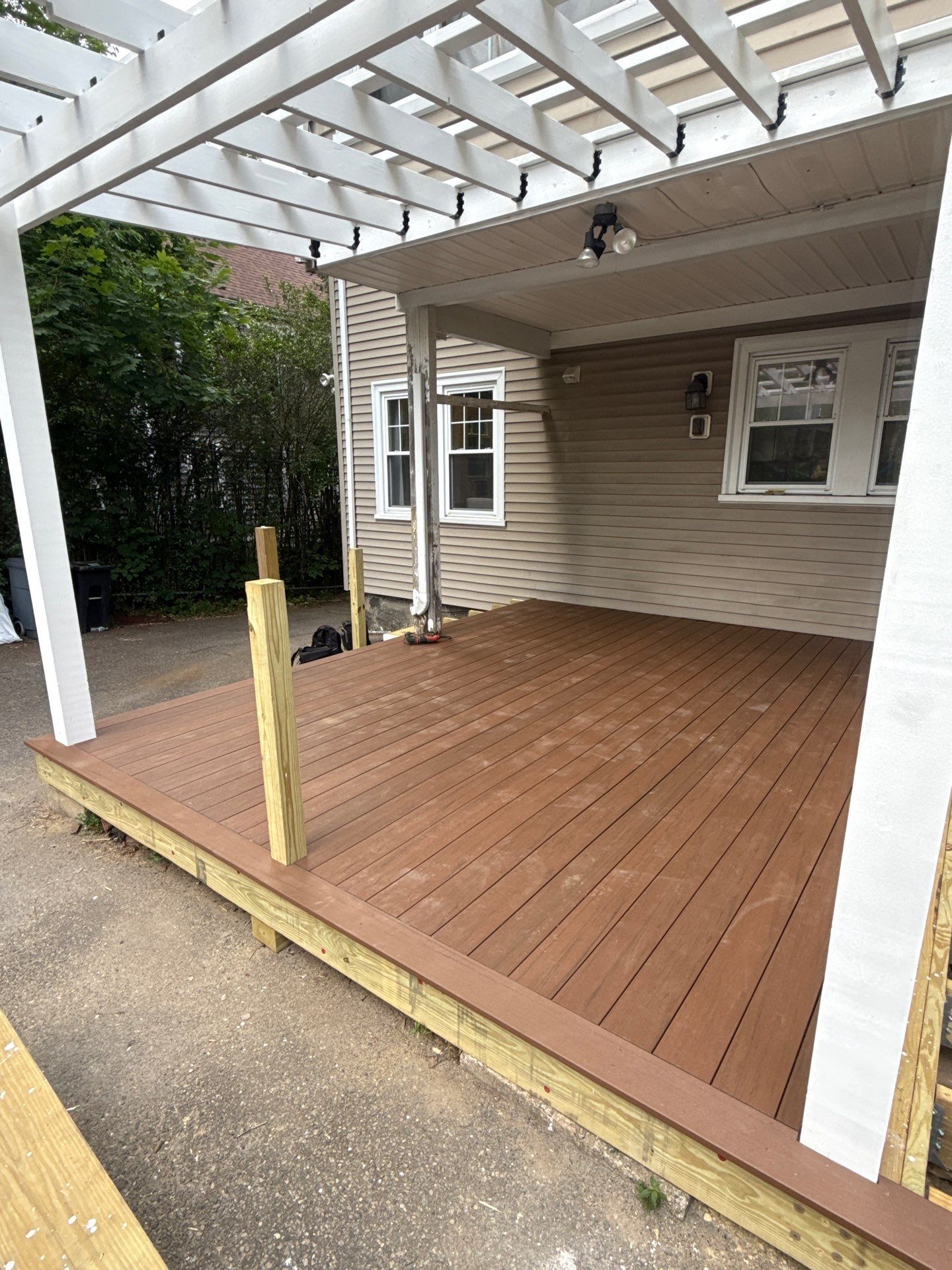 new deck with custom pergola by CabralCarpentry & Painting LLC
