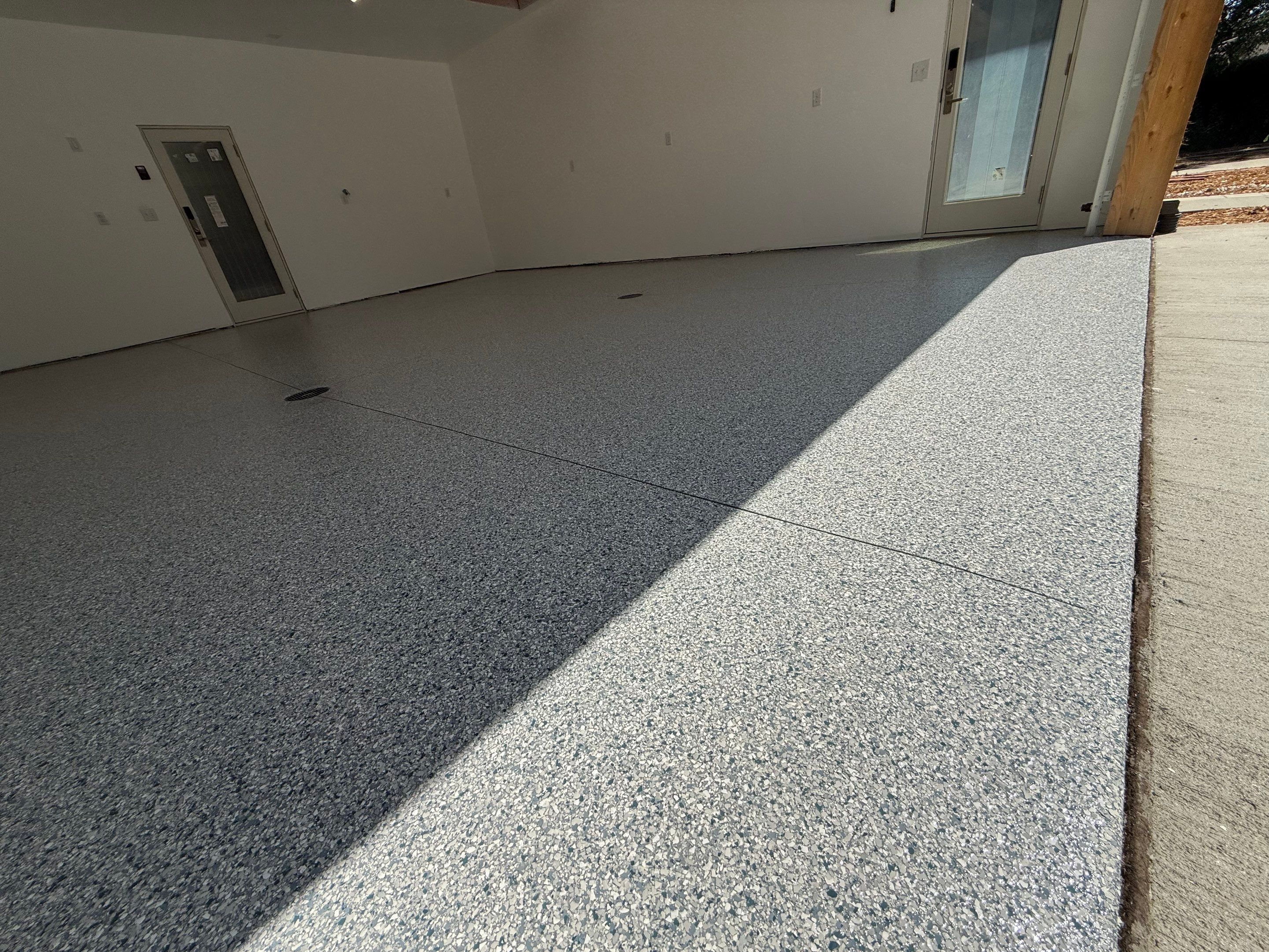 Multi-Car Garage Floor Coating Installation in Sioux Falls by Select Painting, Coatings & Garage Cabinets