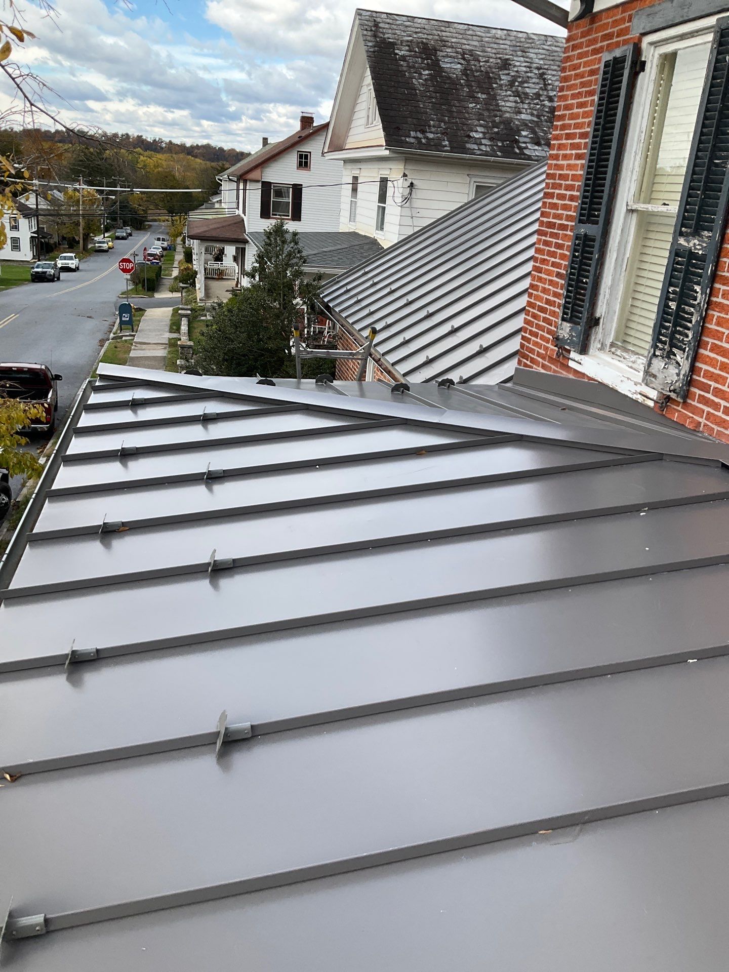 Updated Porch Roof with Clean Standing Seam Lines by Esh Builders