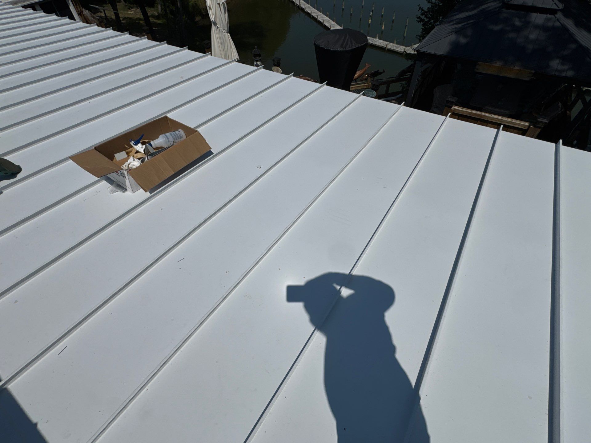 White Standing Seam Metal Roof Installation in Wake, VA by Cade Construction