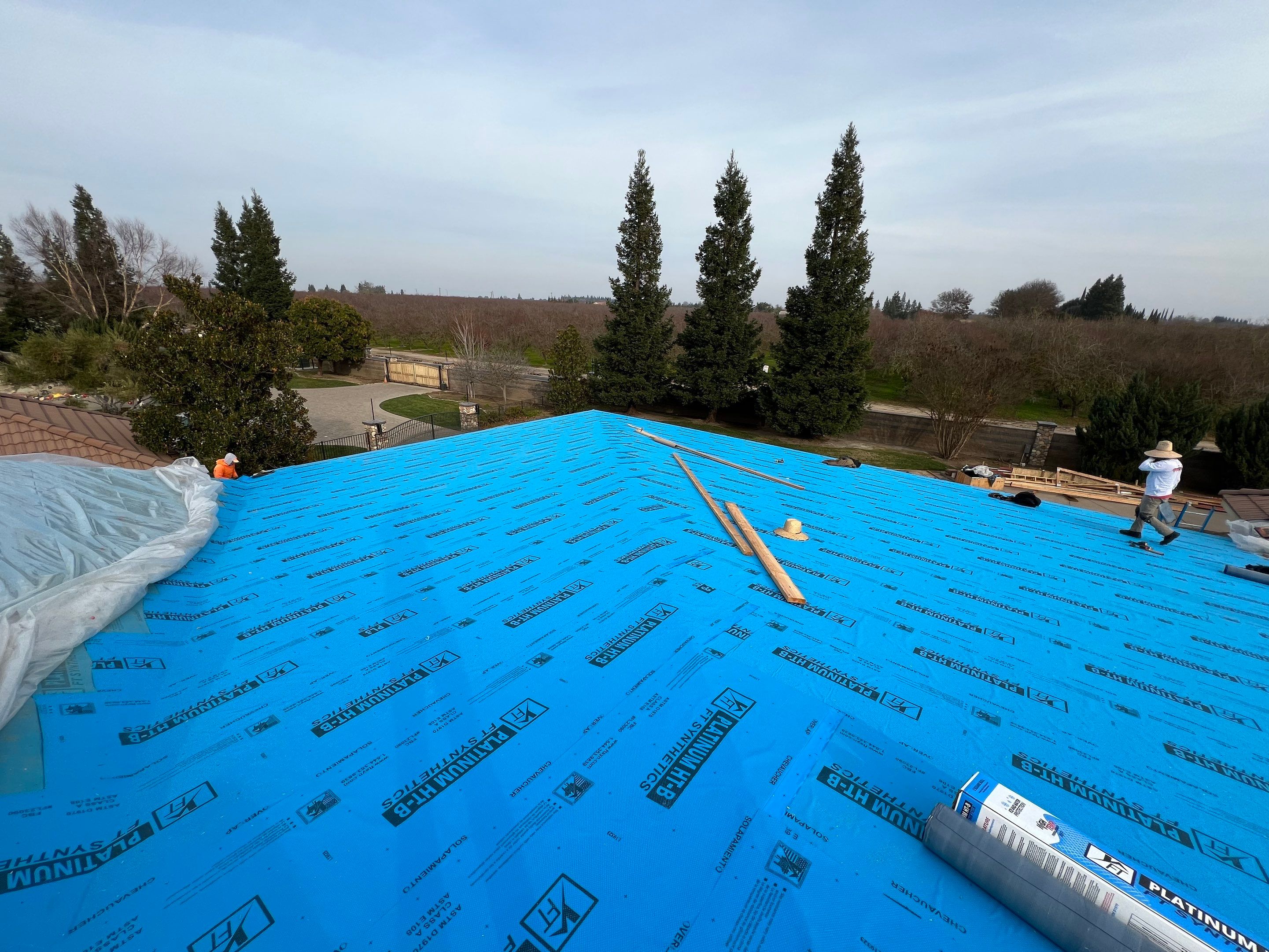 Tile, Metal, and TPO roofing project (new construction) by Straight Edge Roofing Inc