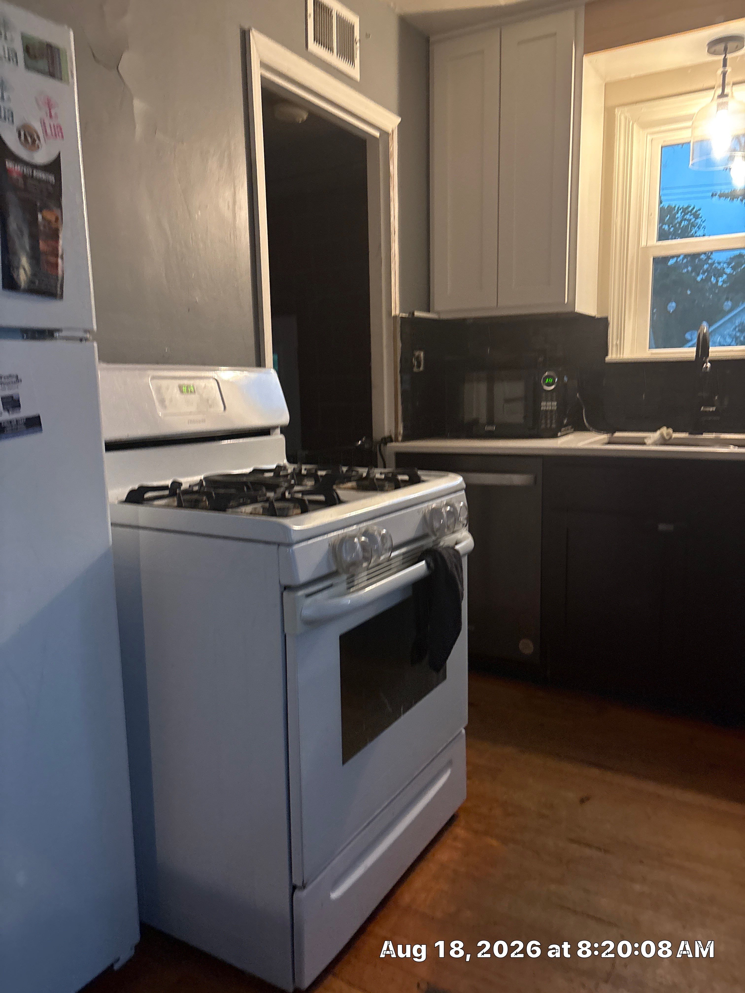 Lincoln Kitchen Renovation Featuring Black and White Shaker Cabinetry by CompanyCam Sales Demo