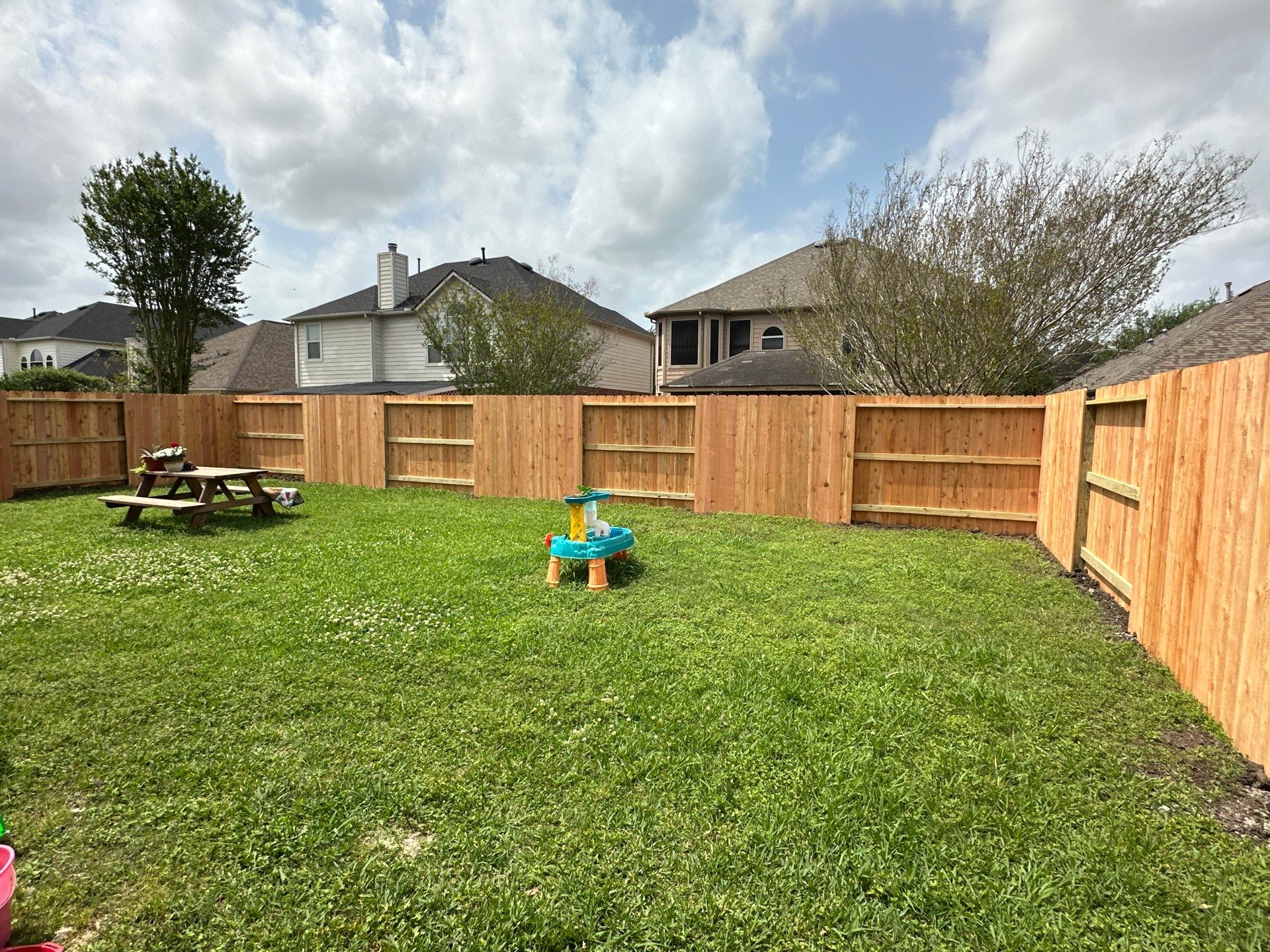 Wood fence with alternating panels by Tim's Fences