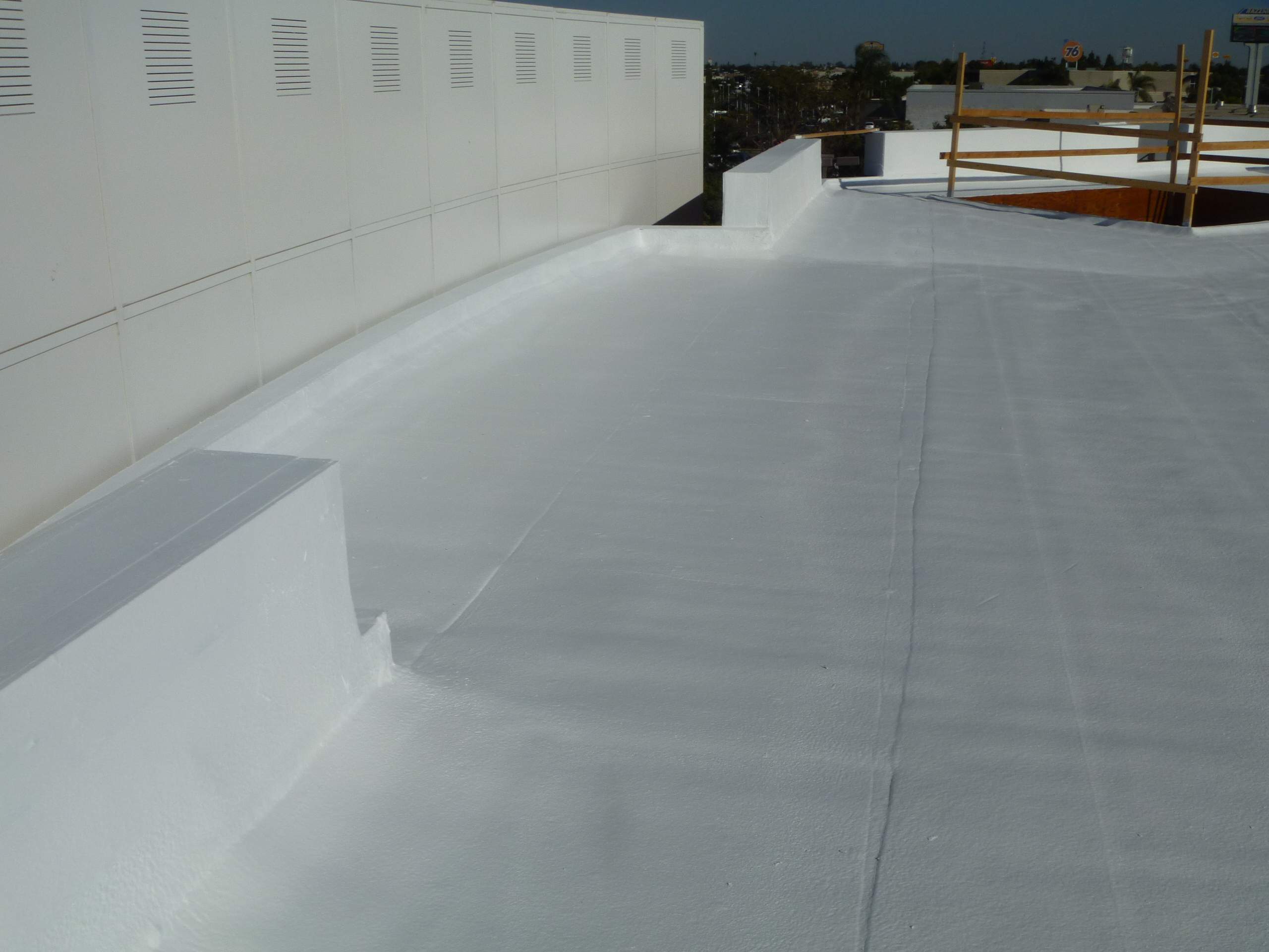 Commercial Roofing Installation using Spray foam and Conklin Benchmark/PUMA XL 18 yr warranty coatings by Straight Edge Roofing Inc